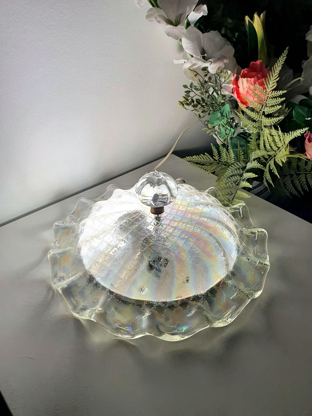Flowing floral silhouette of a vintage Italian glass ceiling light
