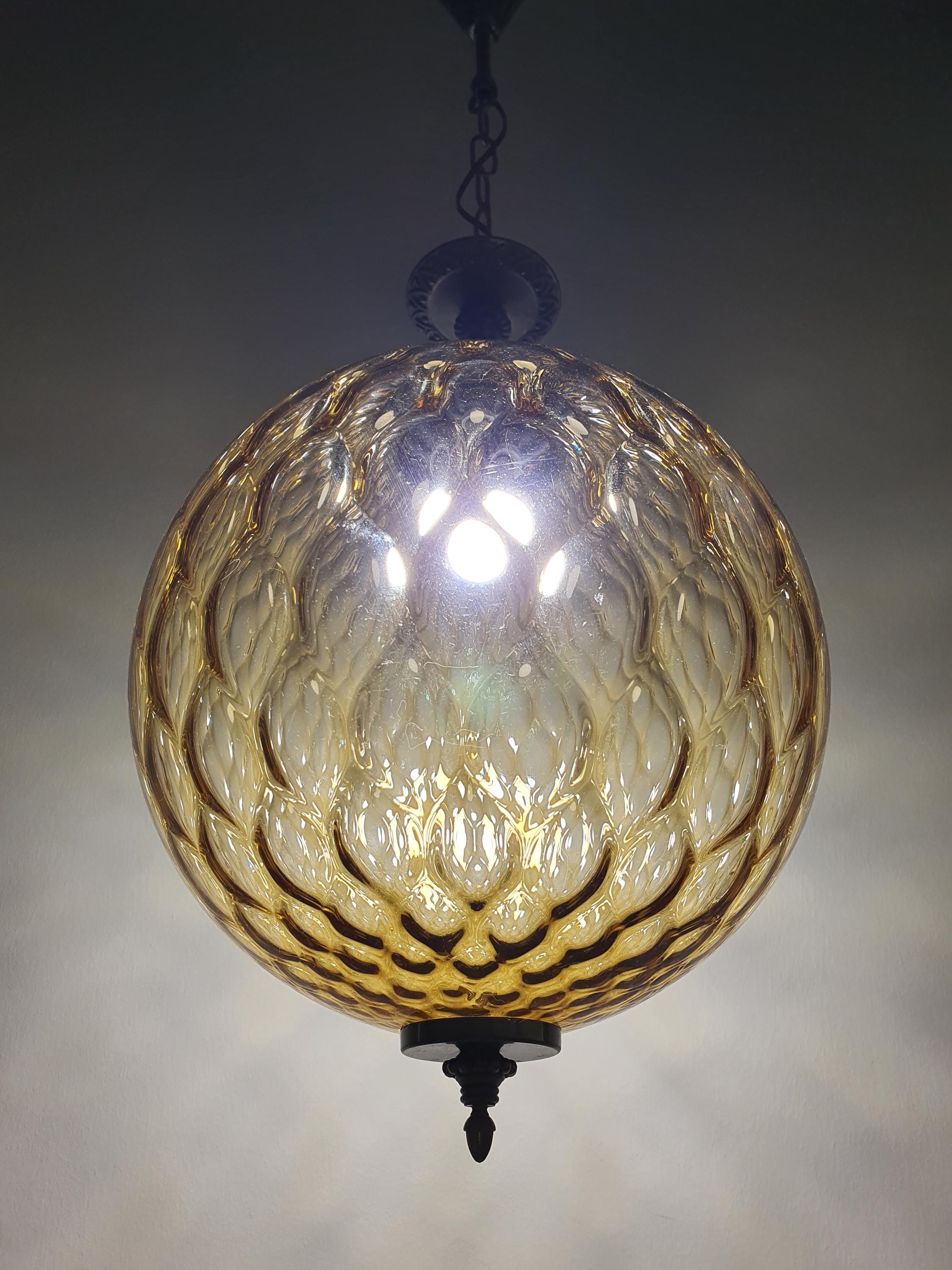 Vintage Italian Art Deco pendant light unlit, showing glass texture and brass patina