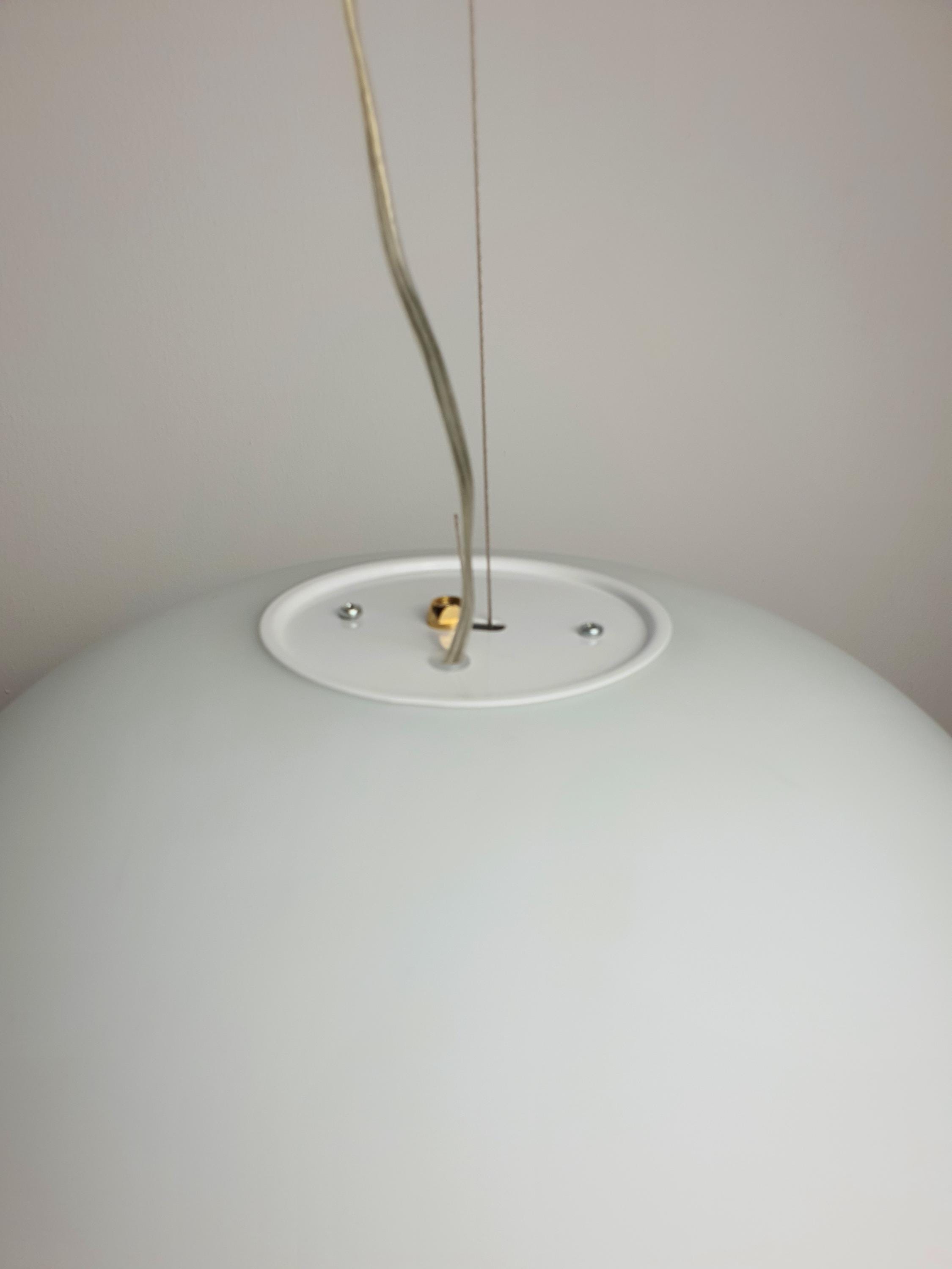 Satin opaline glass globe pendant — pure spherical geometry, contemporary interior