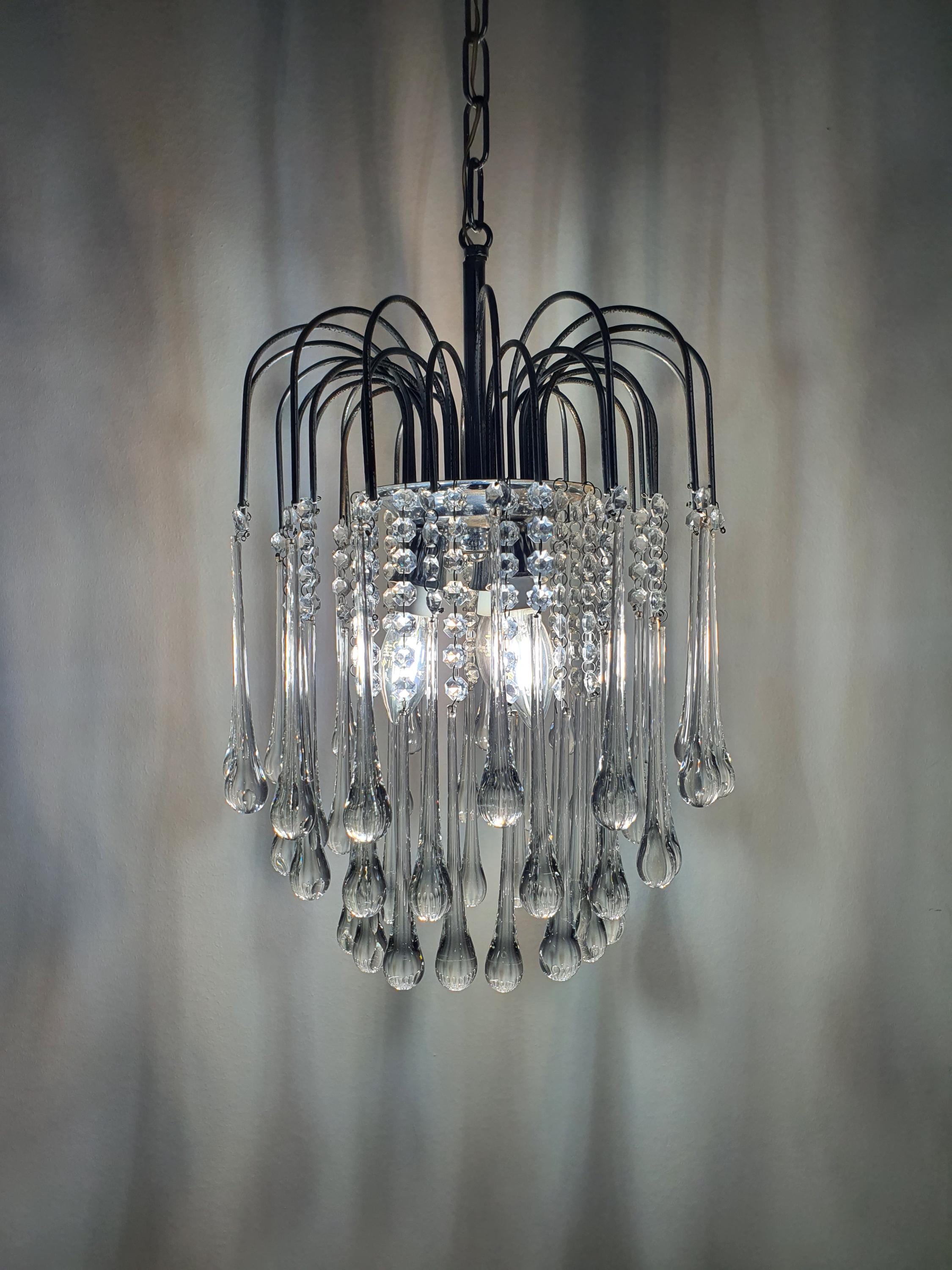 Vintage Murano clear teardrop cascade chandelier lit, sparkling clear glass drops, chrome frame, glamorous Hollywood Regency glow