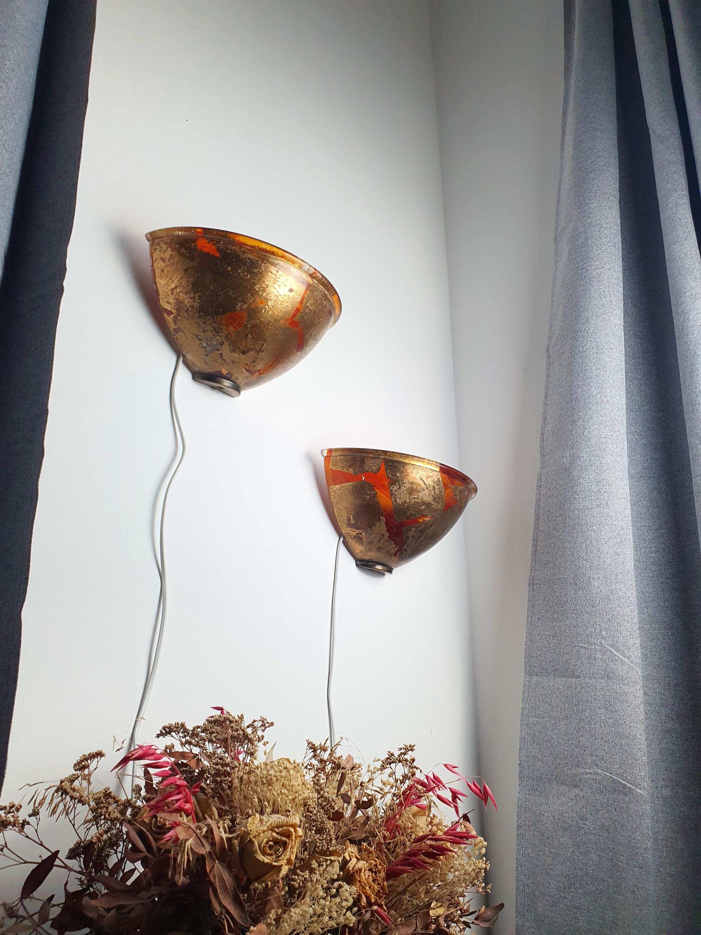 2B Illuminazione wall sconce — golden bronze painted glass shade, warm ambient glow