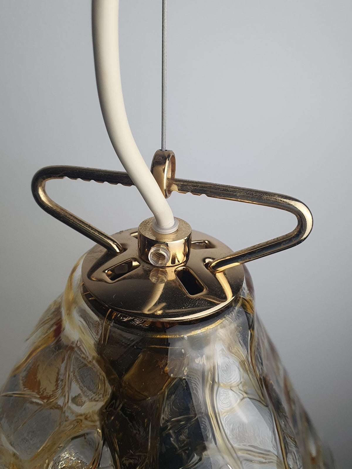 Gold-toned metal fitting on a vintage La Murrina Murano glass pendant
