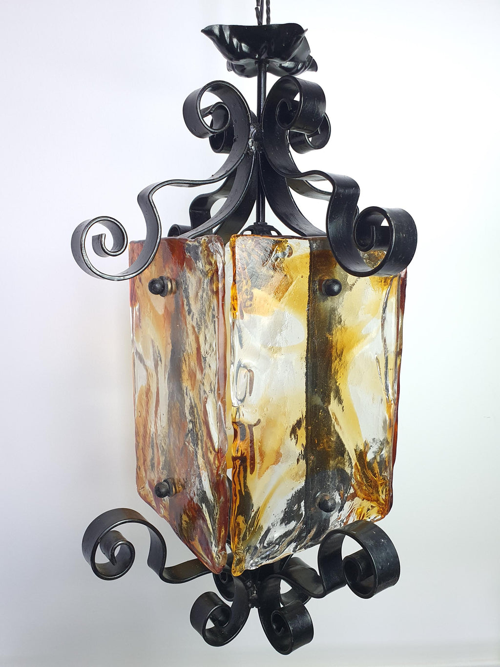 Mazzega style Murano pendant in entryway, dramatic amber black glass, black wrought iron, statement high ceiling pendant