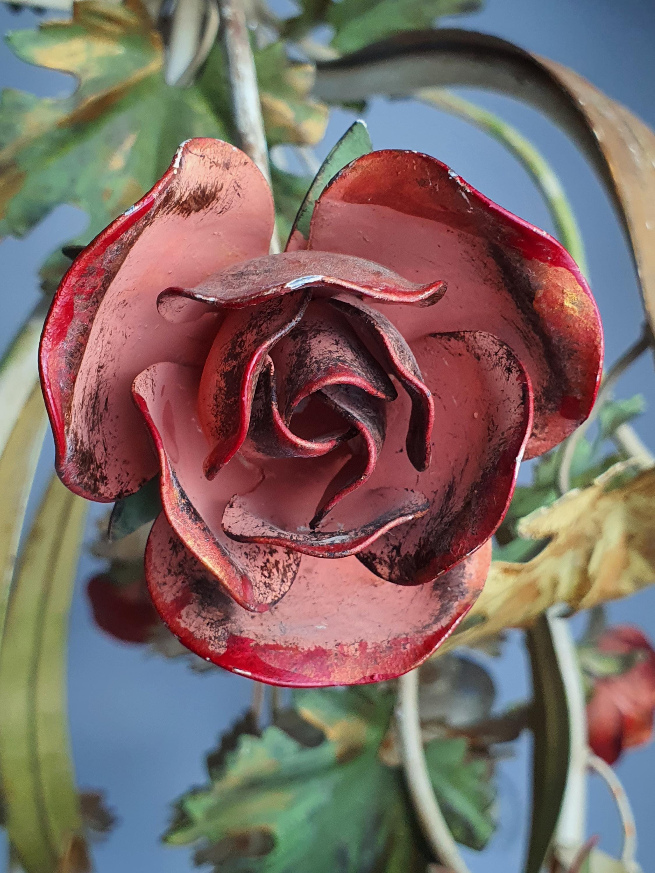 Vintage tole chandelier — hand-painted red roses and gold accent metalwork, close-up