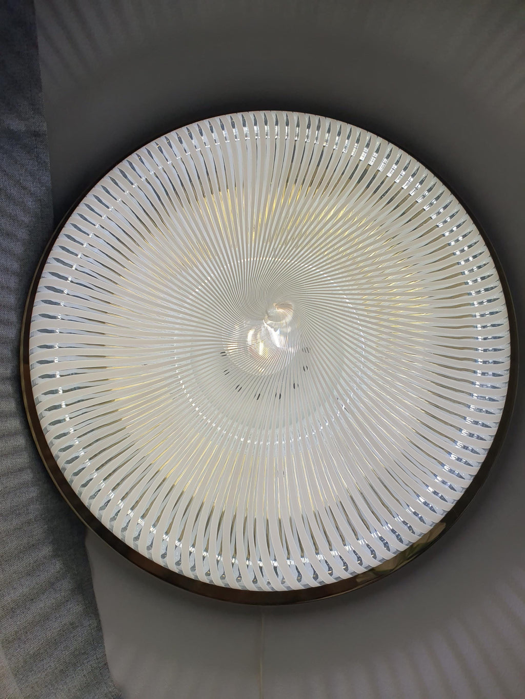 Detail of gold-toned base wear and patina, signed Venini Italia 1984 Murano glass sconce