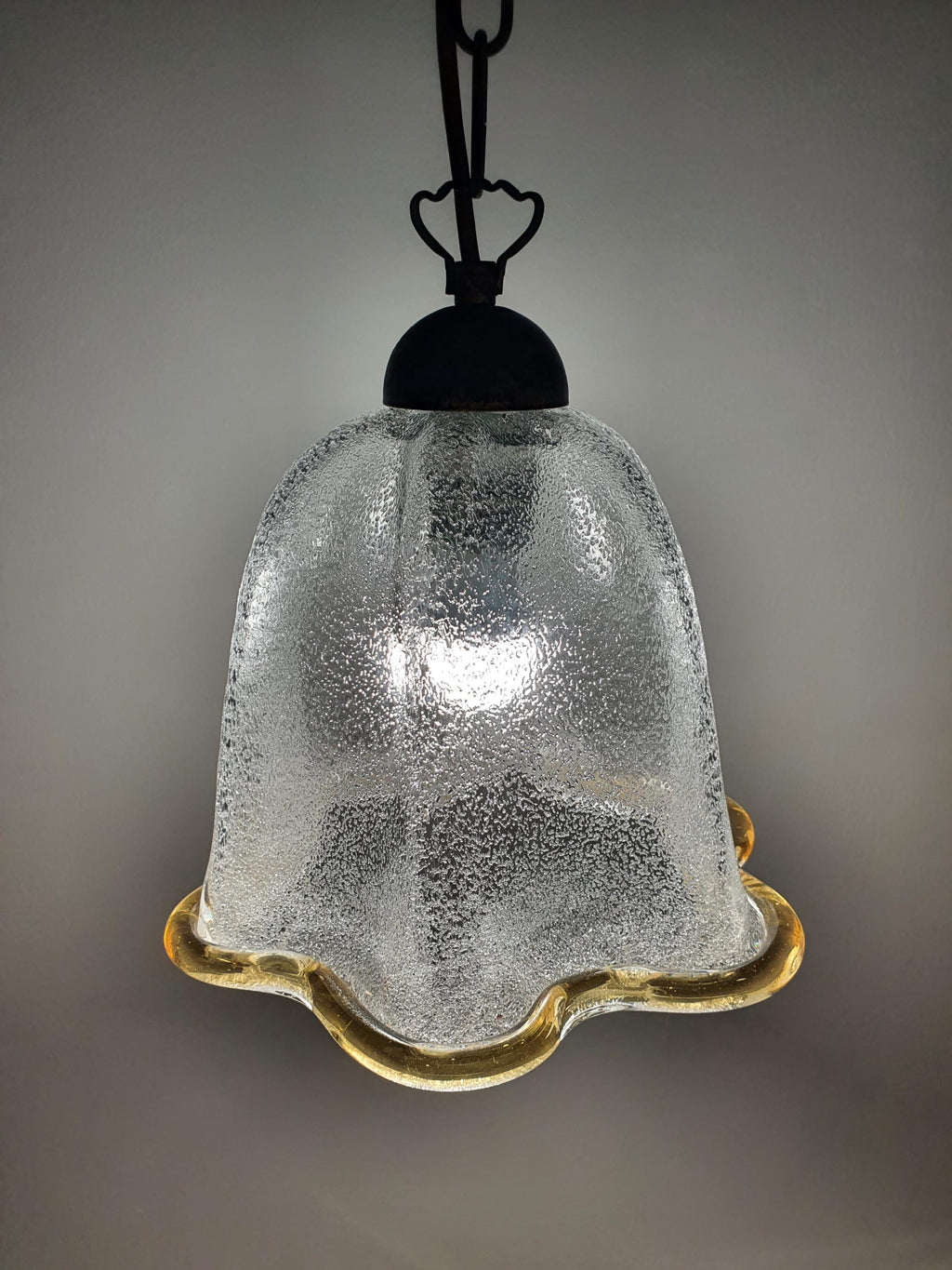 Close-up of graniglia icy glass interior texture on vintage Murano bell tulip pendant, crystalline light diffusion