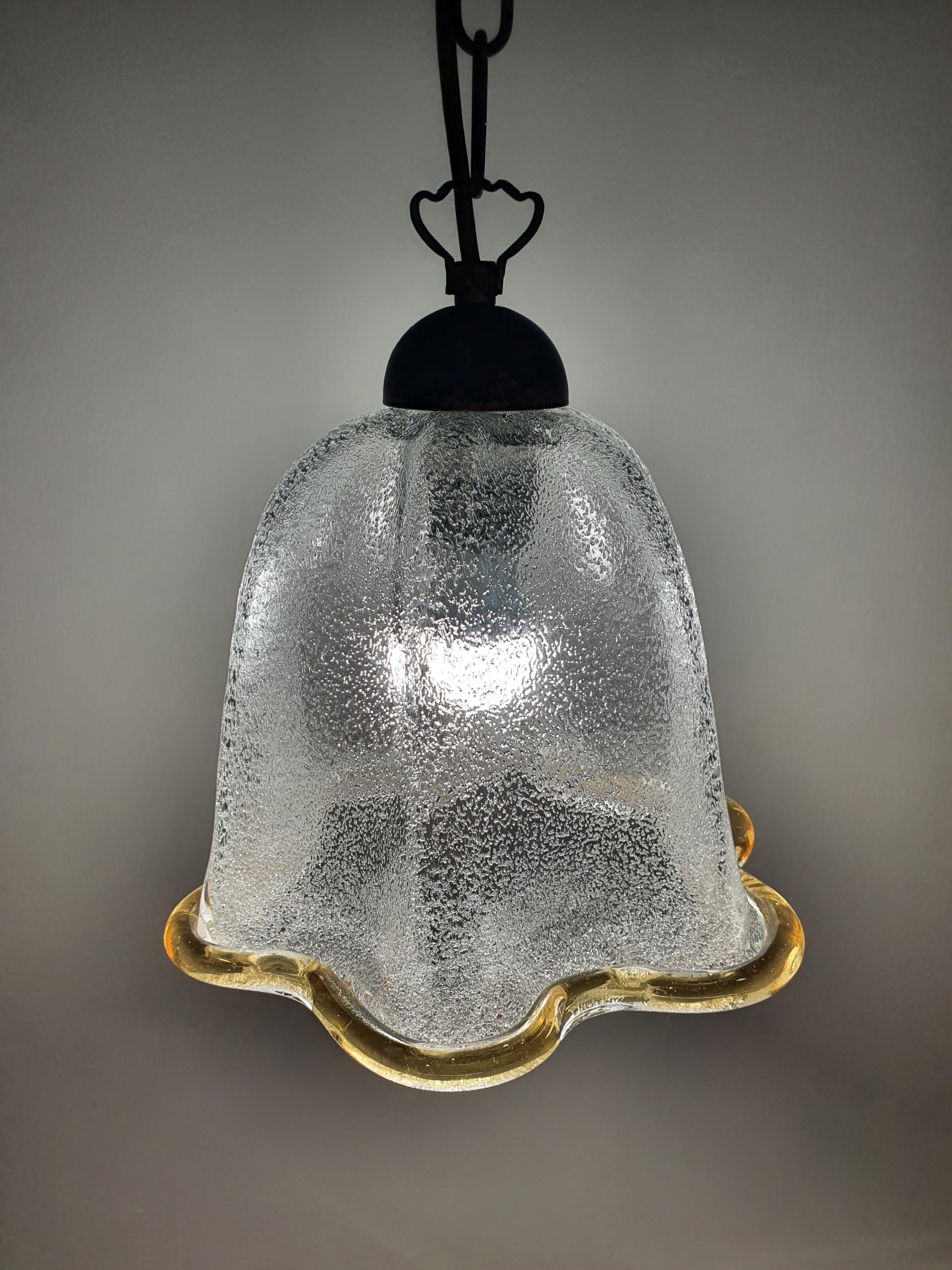 Close-up of graniglia icy glass interior texture on vintage Murano bell tulip pendant, crystalline light diffusion