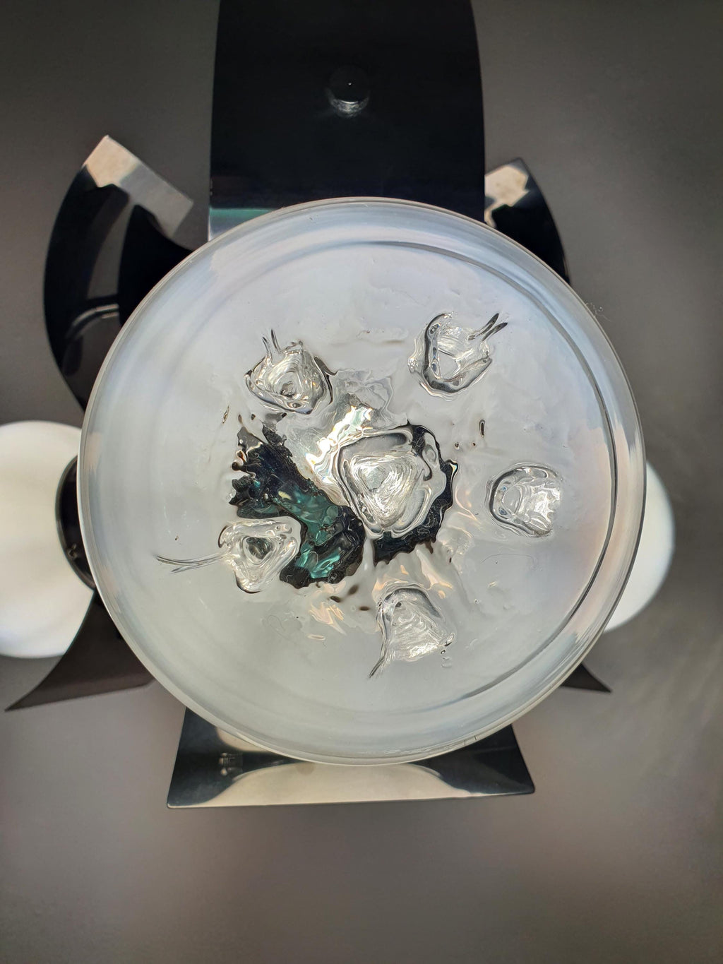 Chrome patina detail on vintage Murano glass Mazzega-style 3-globe chandelier structure, 1970s Italy