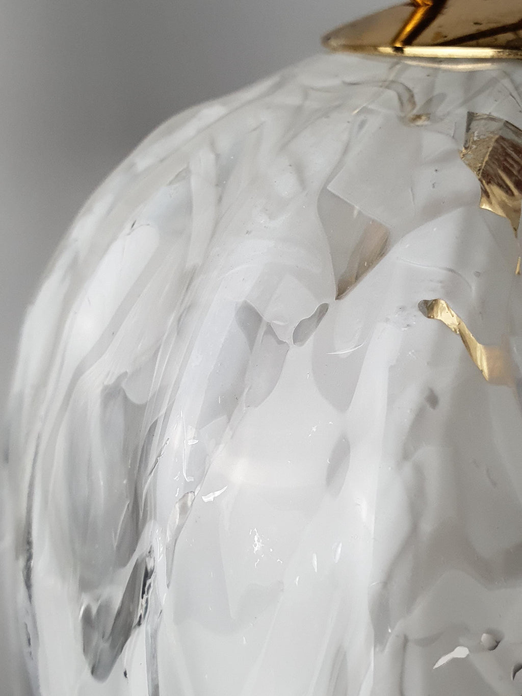 Softly undulating edges of a vintage La Murrina Murano glass pendant shade
