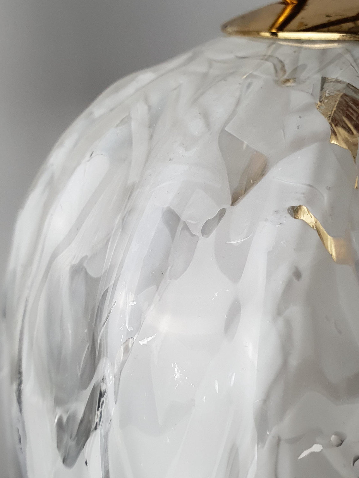Softly undulating edges of a vintage La Murrina Murano glass pendant shade
