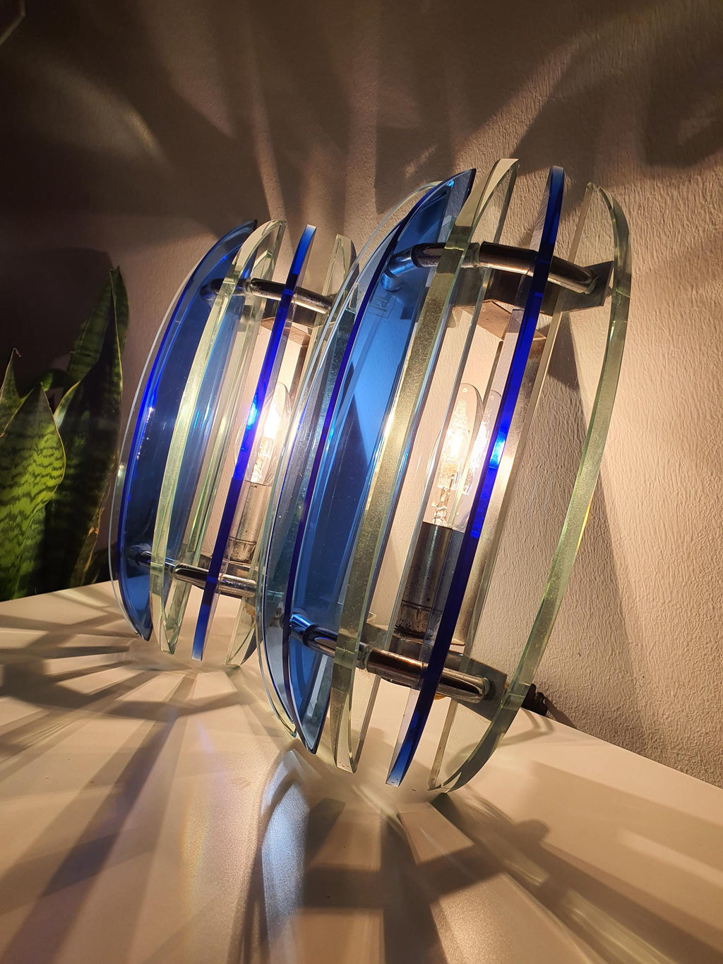 Pair of Veca UFO sconces — both fixtures shown together, hallway or bedroom setting