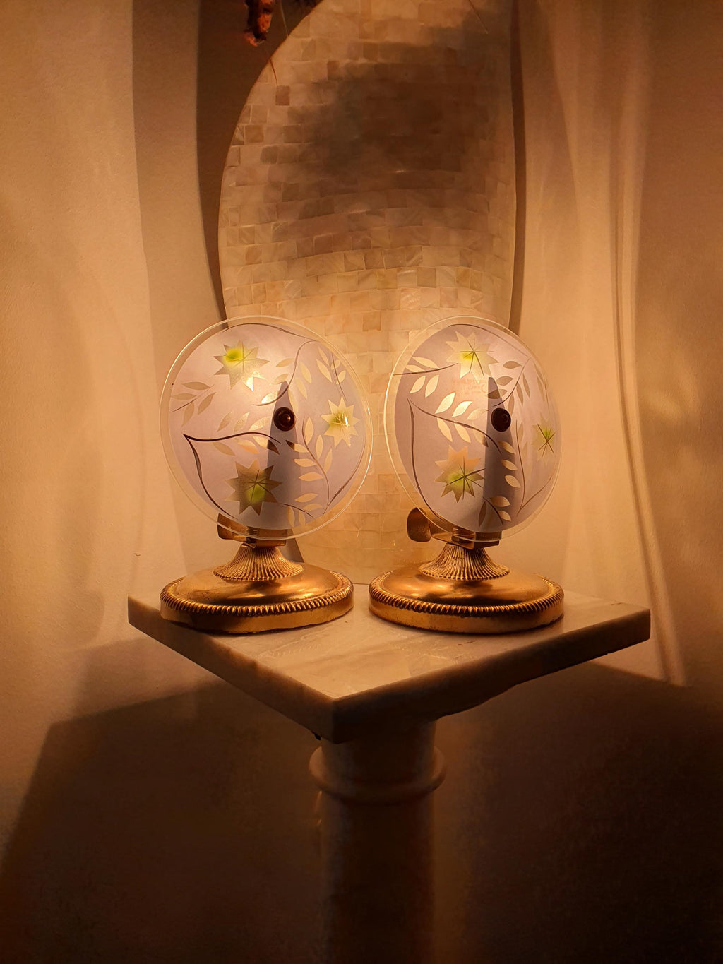 Vintage Italian bedside light — illuminated, warm blue and gold glow through handpainted glass