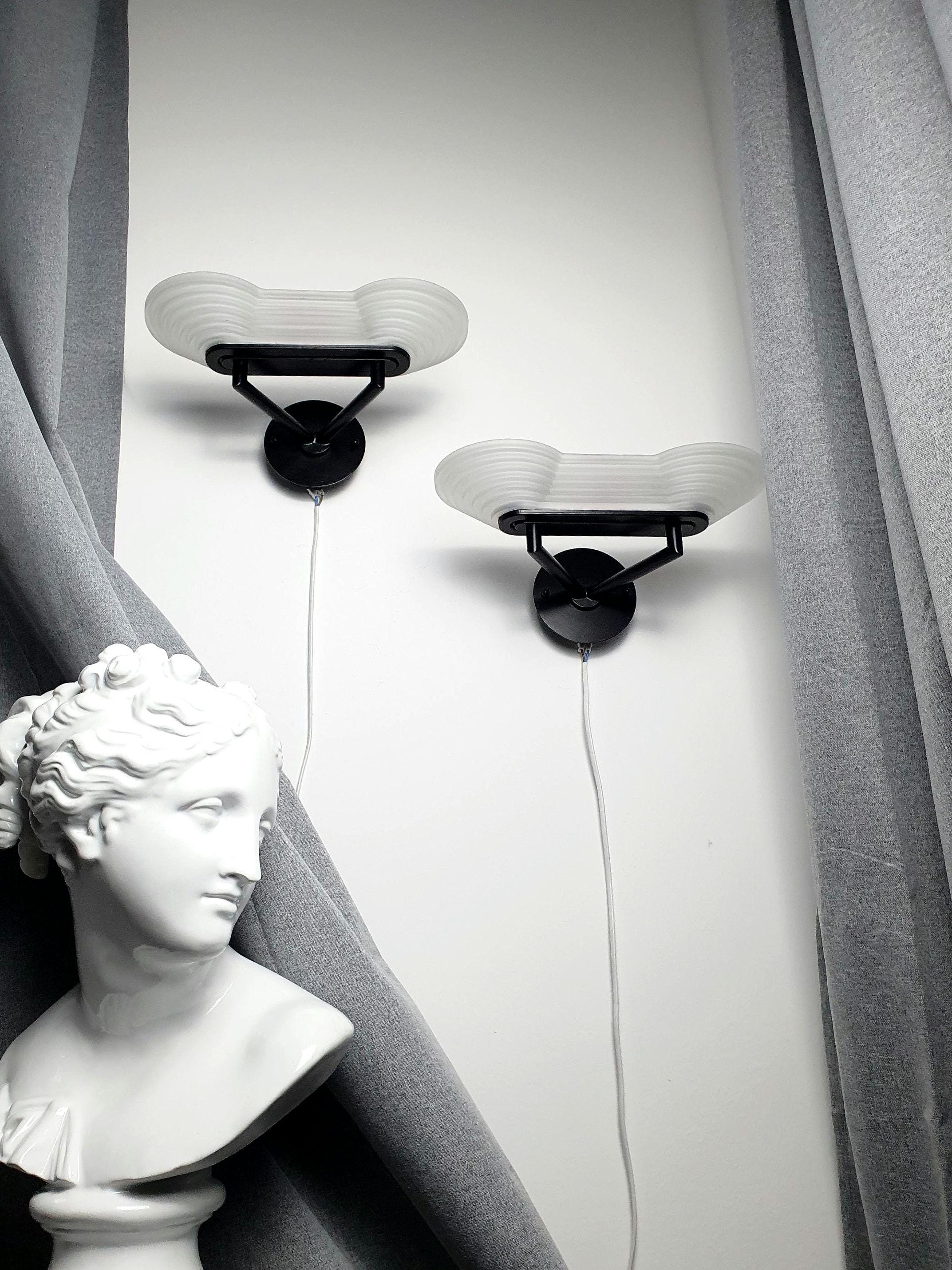 Pair of vintage Italian Memphis Postmodern wall lights, thick satin glass stepped pyramid diffusers, black metal bases, 1980s