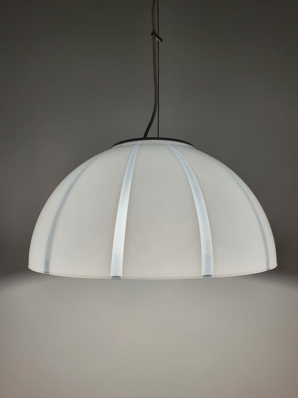 Gold-toned canopy detail on vintage Murano white and clear striped bell pendant, warm metal contrast to crisp glass