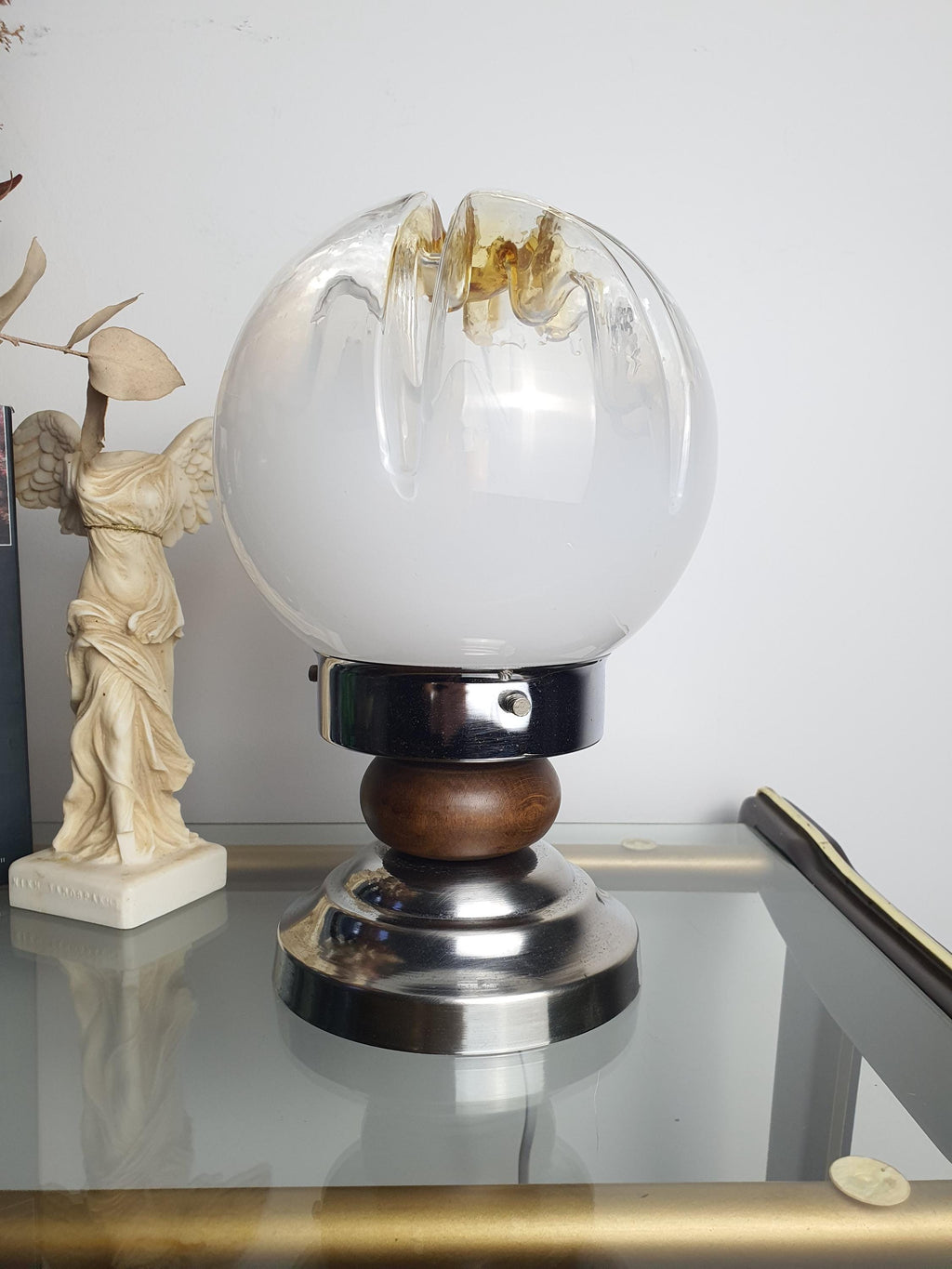 Amber crown accent detail on vintage Mazzega Murano white-to-clear gradient globe table lamp, 1970s Italy