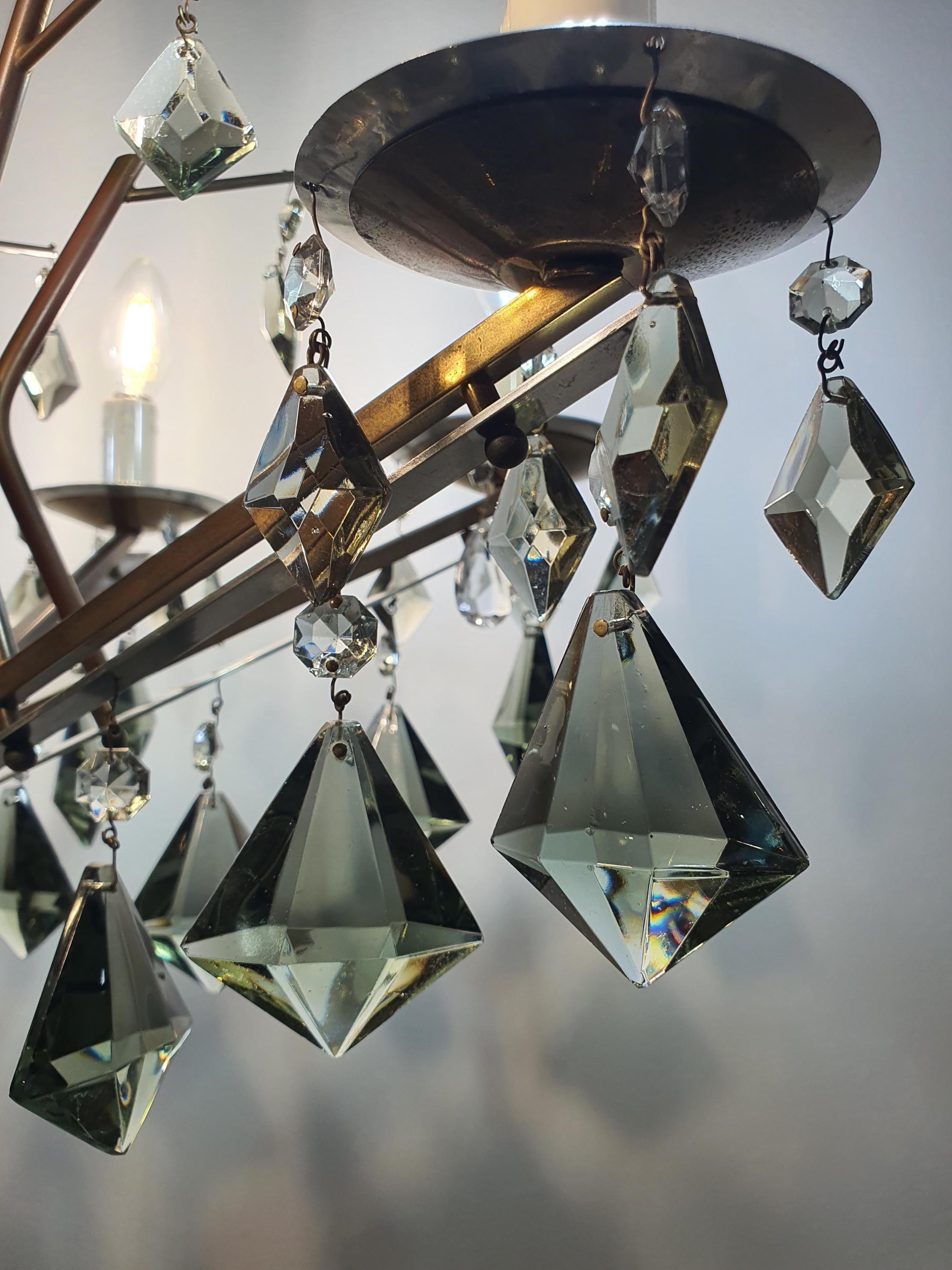 Underside view of vintage Art Deco 6-arm chandelier, six candle holders, smoky grey crystal drop canopy