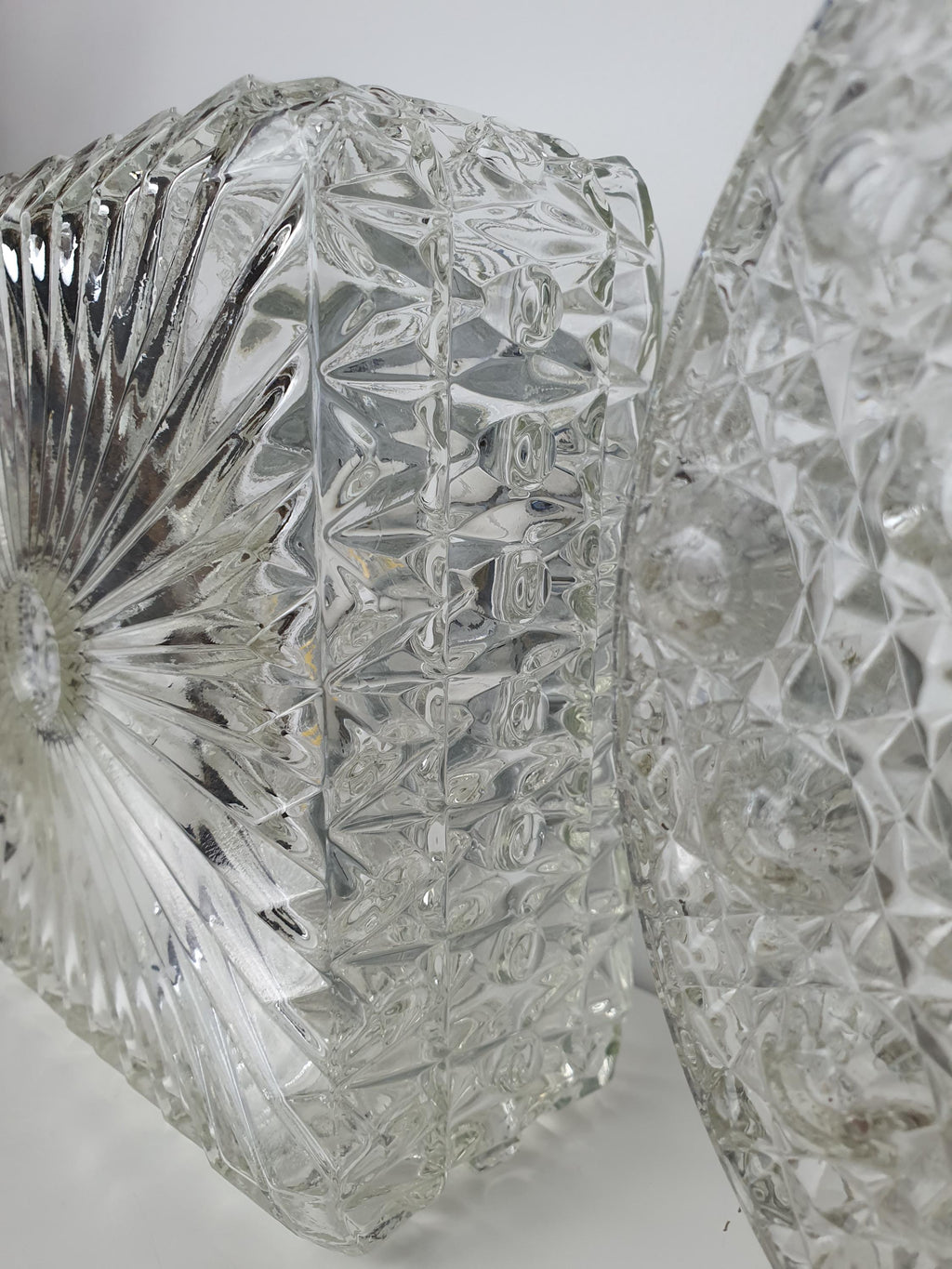 Detail of the irregular stamped texture on a clear glass sconce
