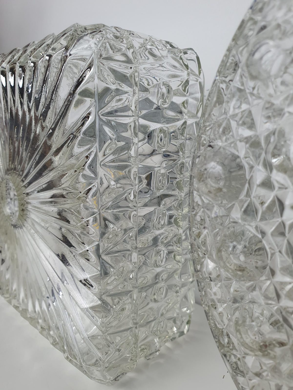 Detail of the irregular stamped texture on a clear glass sconce
