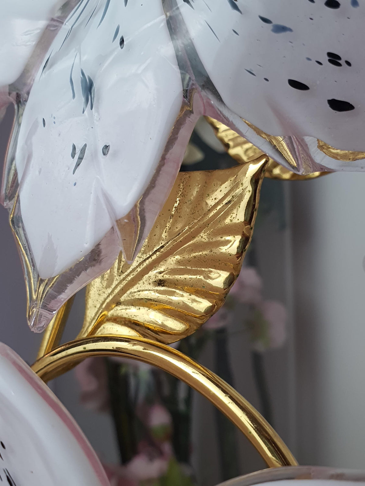 Gold-toned metal base on a vintage Murano glass flower lamp
