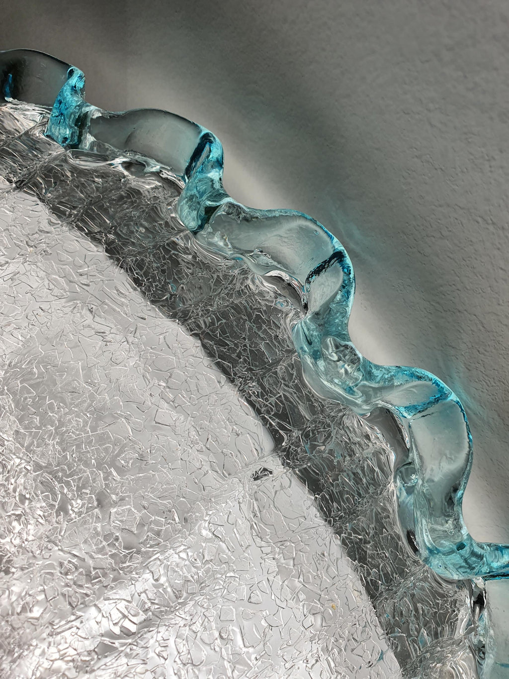 Smooth glass surface and textured reverse of a vintage Graniglia light shade
