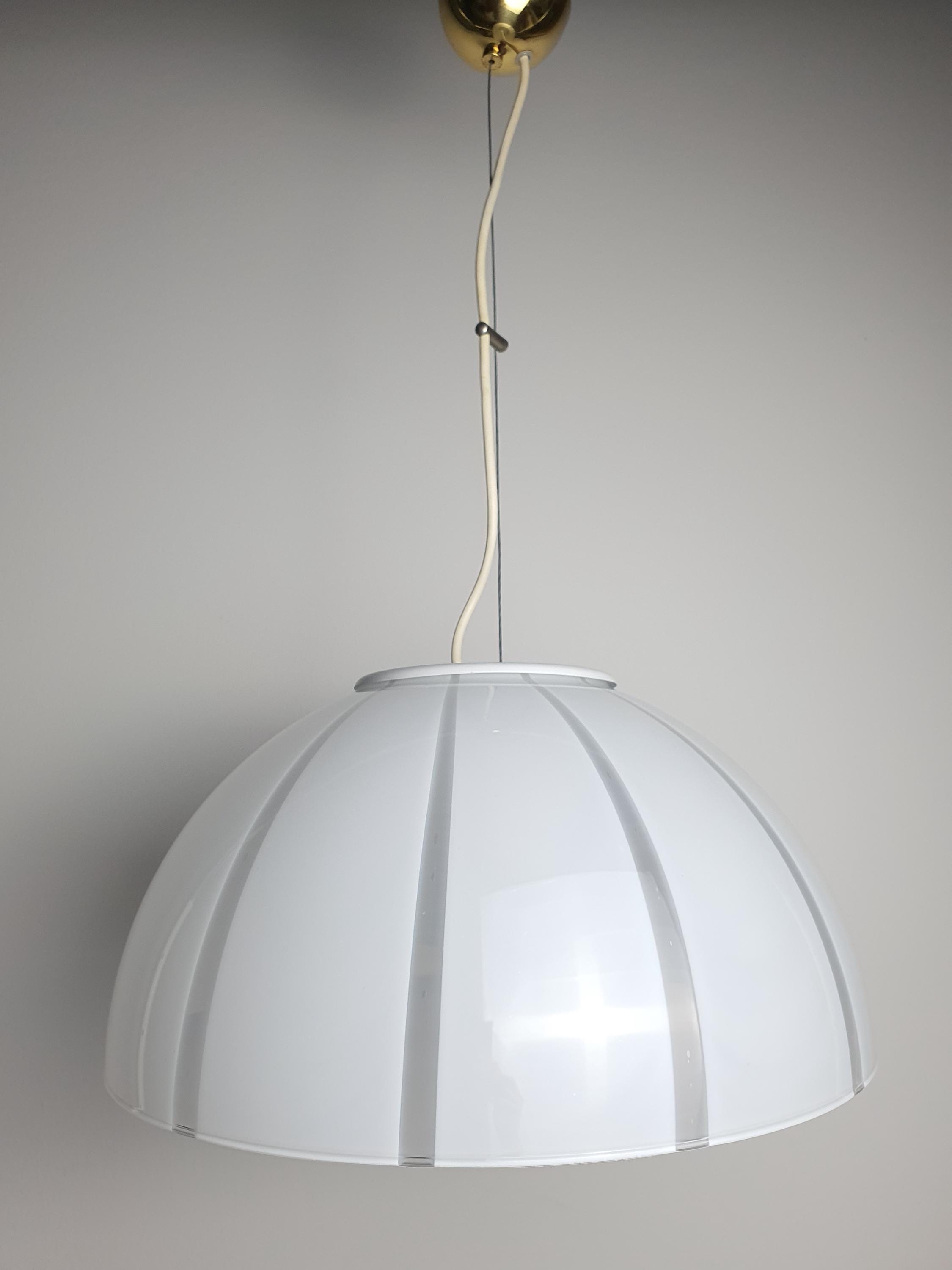Vintage Murano bell pendant in kitchen, white clear striped glass, gold canopy, minimalist Italian pendant light