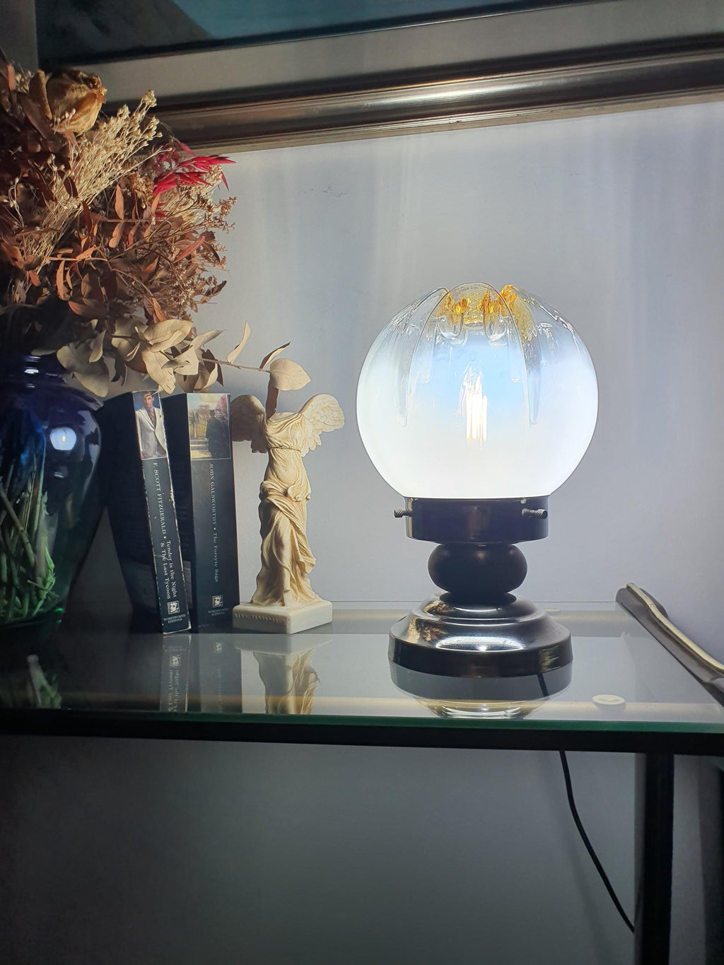 Vintage Mazzega Murano table lamp as bedside light, warm amber glow, wood chrome base, 1970s Italian MCM bedroom