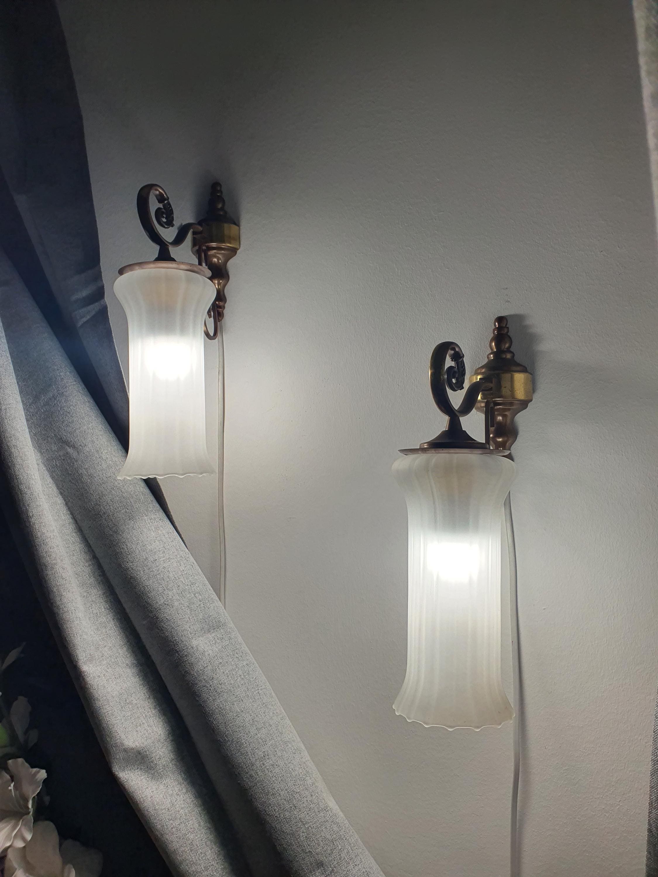 Vintage Italian satin frosted flute wall sconce front view, elongated flute form, brass base, soft ambient diffusion