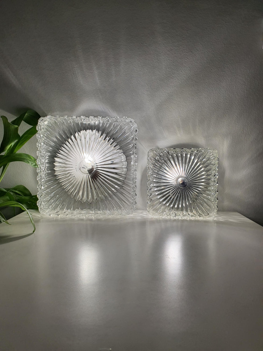 Set of 2 Brutalist MCM Midcentury wall sconces in stamped clear glass