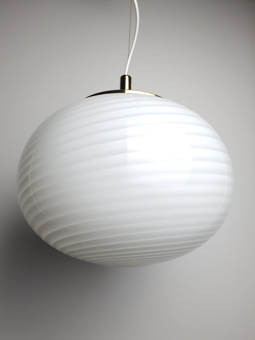 Hand-blown Murano glass globe shade with delicate white swirls
