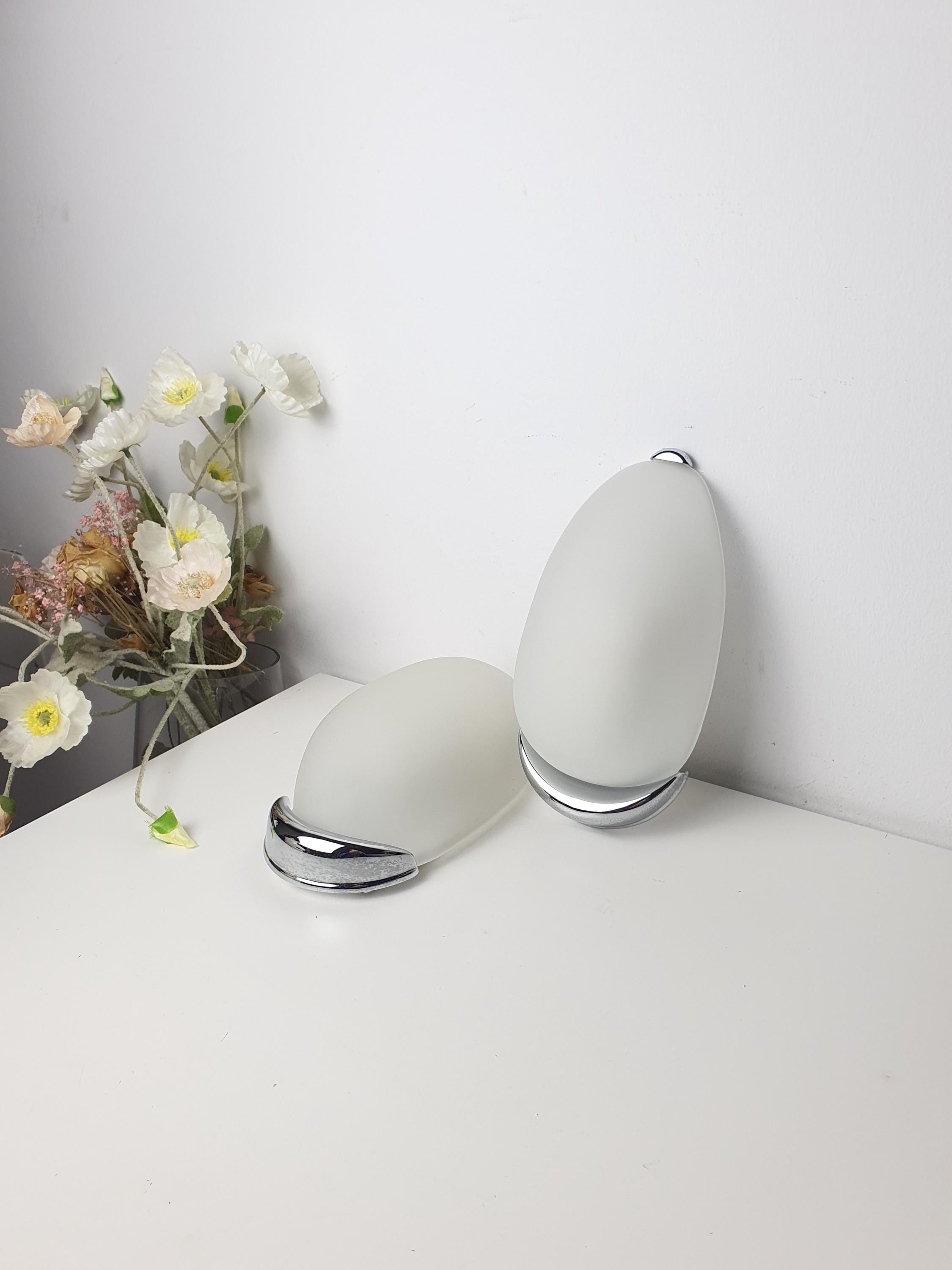 Pair of vintage Italian egg-form wall sconces, satin frosted glass shades on chrome bases, MCM Scandinavian style