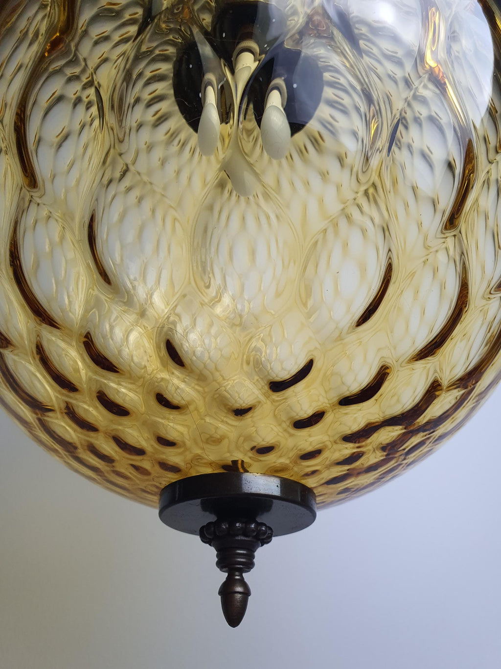 Underside view of caramel honeycomb Murano glass globe, E27 socket visible
