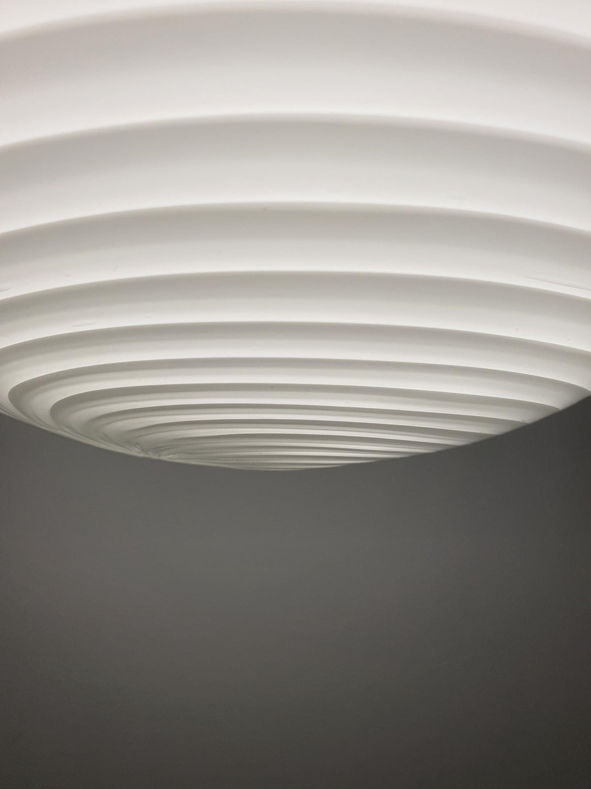 Delicate white glass swirls on a hand-blown Murano pendant shade
