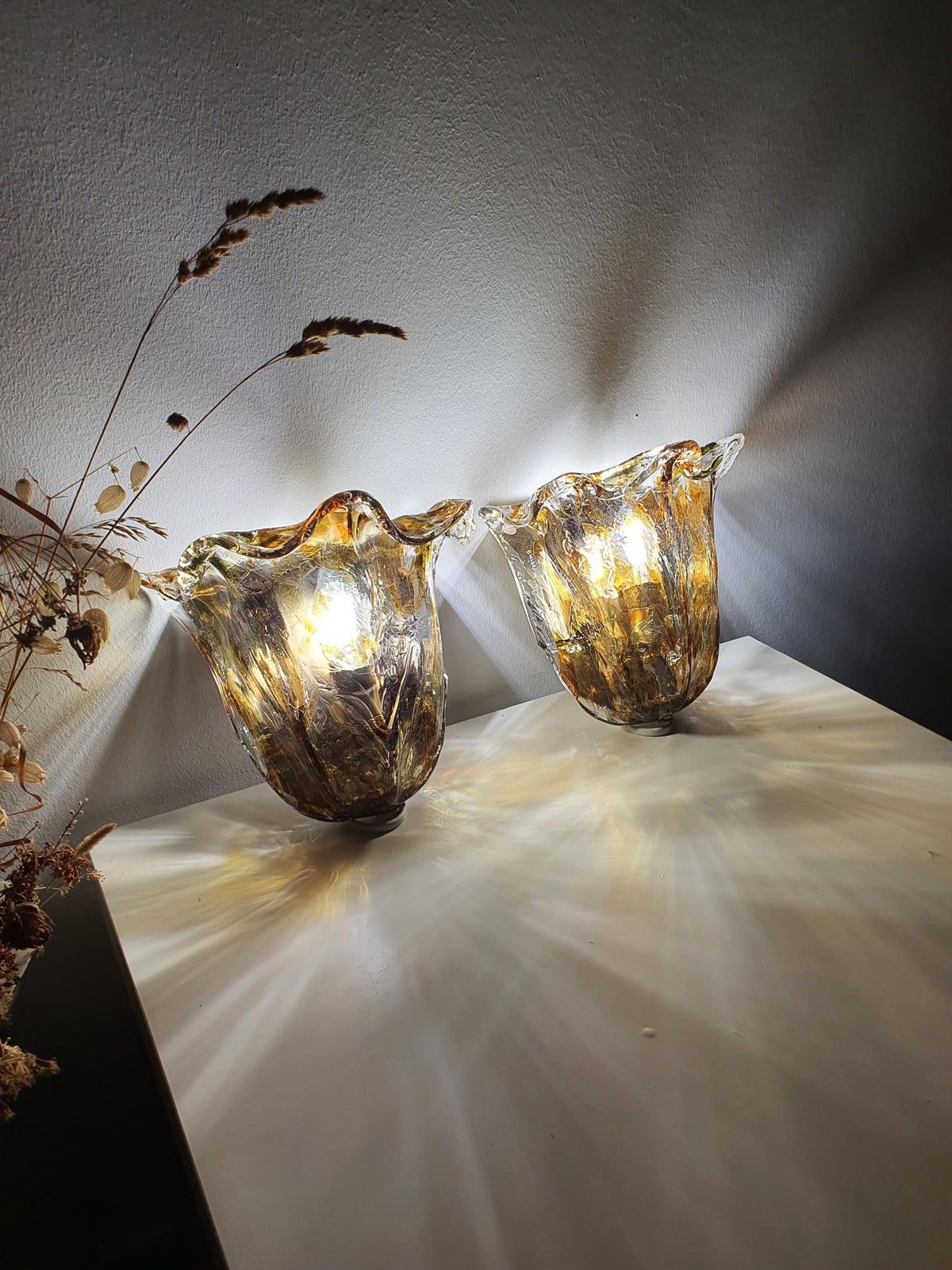 Different gold-toned mounting bases on a pair of La Murrina sconces
