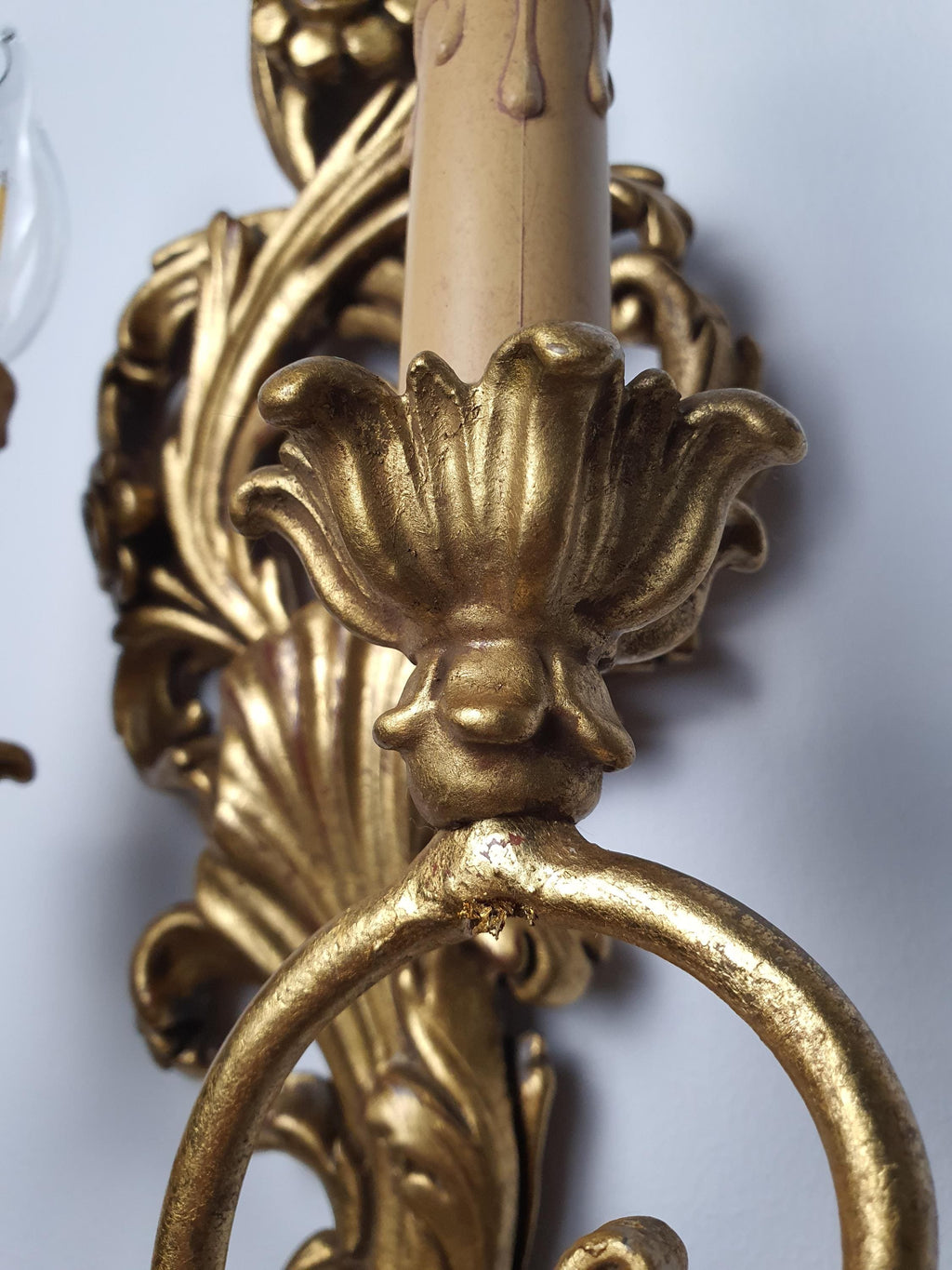 Warm aged gold finish on a vintage wooden candle wall light
