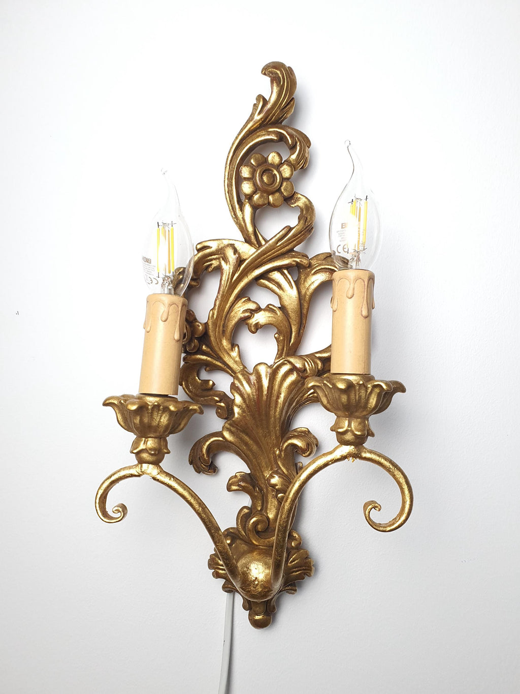 Italian wooden wall sconce with two curved candle-style arms
