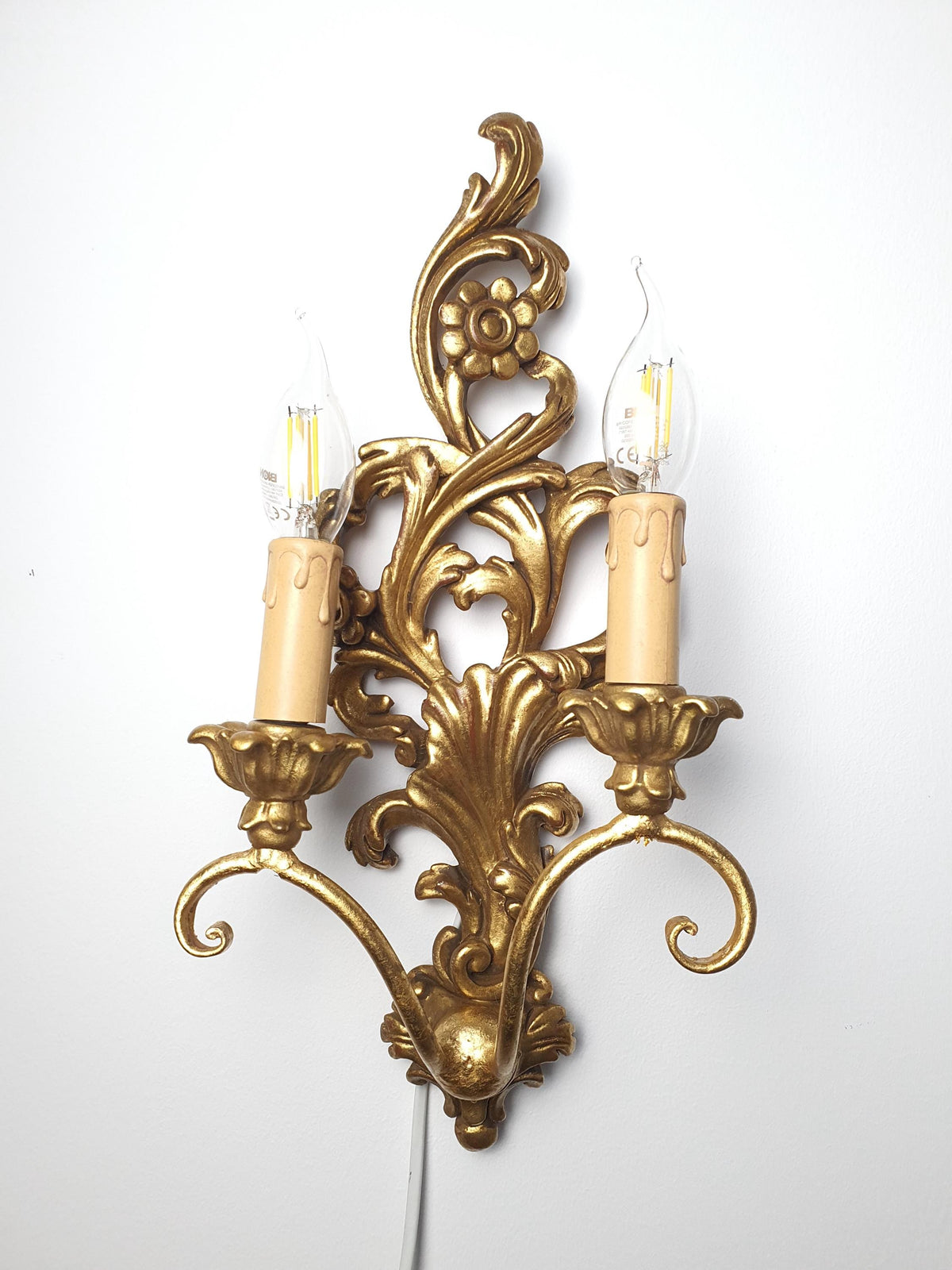 Italian wooden wall sconce with two curved candle-style arms
