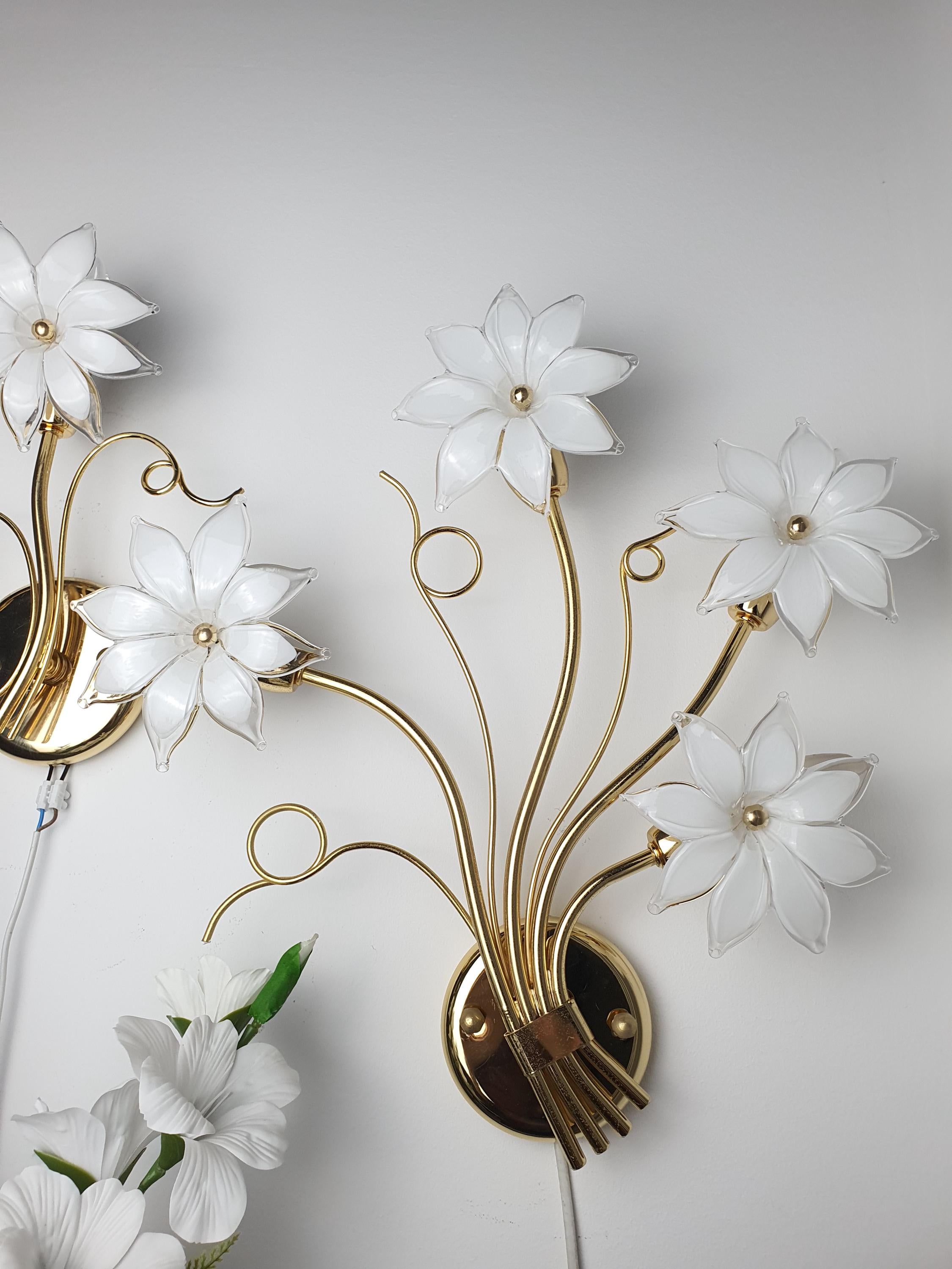 Asymmetrical pair of vintage Italian Murano glass floral sconces in bedroom, white blooms soft glow, Hollywood Regency romantic