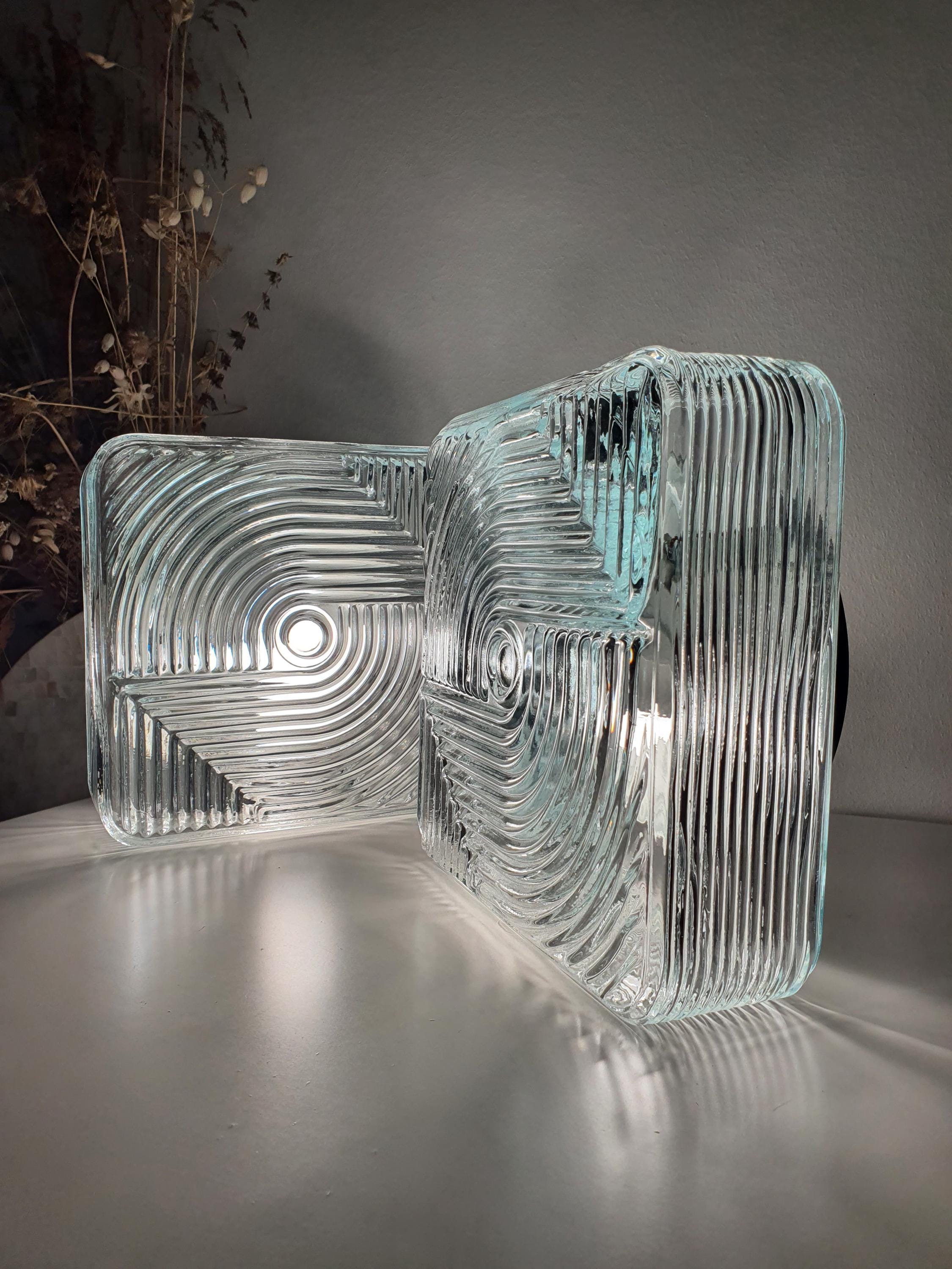 Pair of vintage square Brutalist MCM wall sconces in hallway, stamped clear glass, mixed metal bases, modernist loft interior