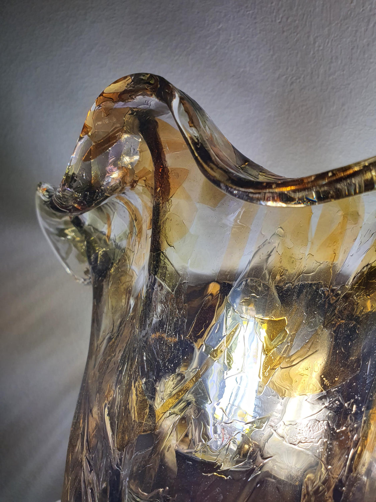 Thick handcrafted glass shade with flowing floral curves
