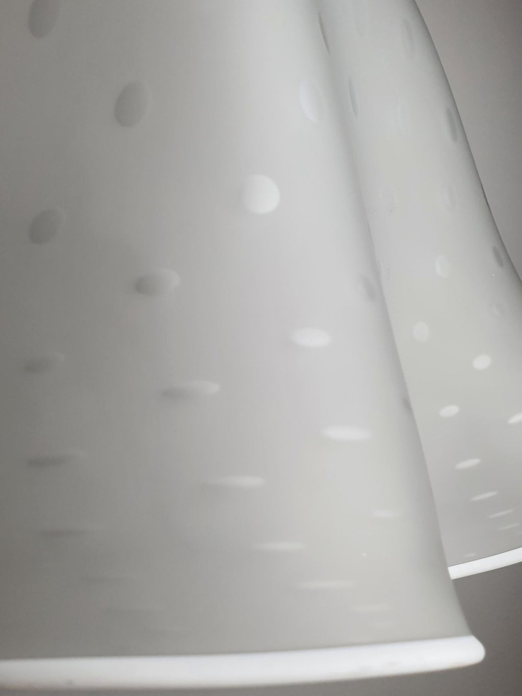 Close-up of trapped pulegoso bubbles in satin white vintage Murano glass Fazzoletto pendant shade