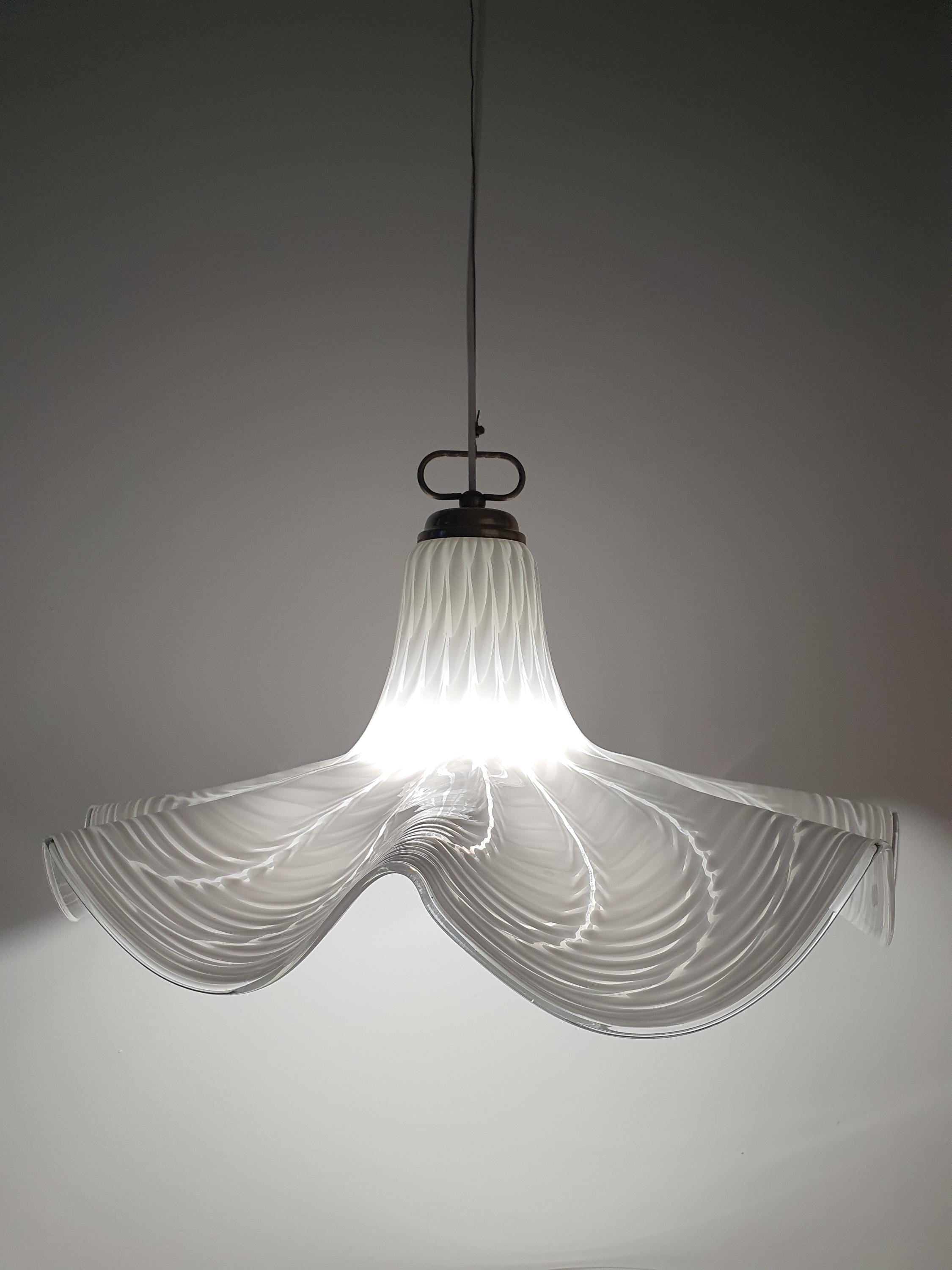 Murano glass Fazzoletto pendant front view, white wave skirt-like folds, gold-toned metal hardware