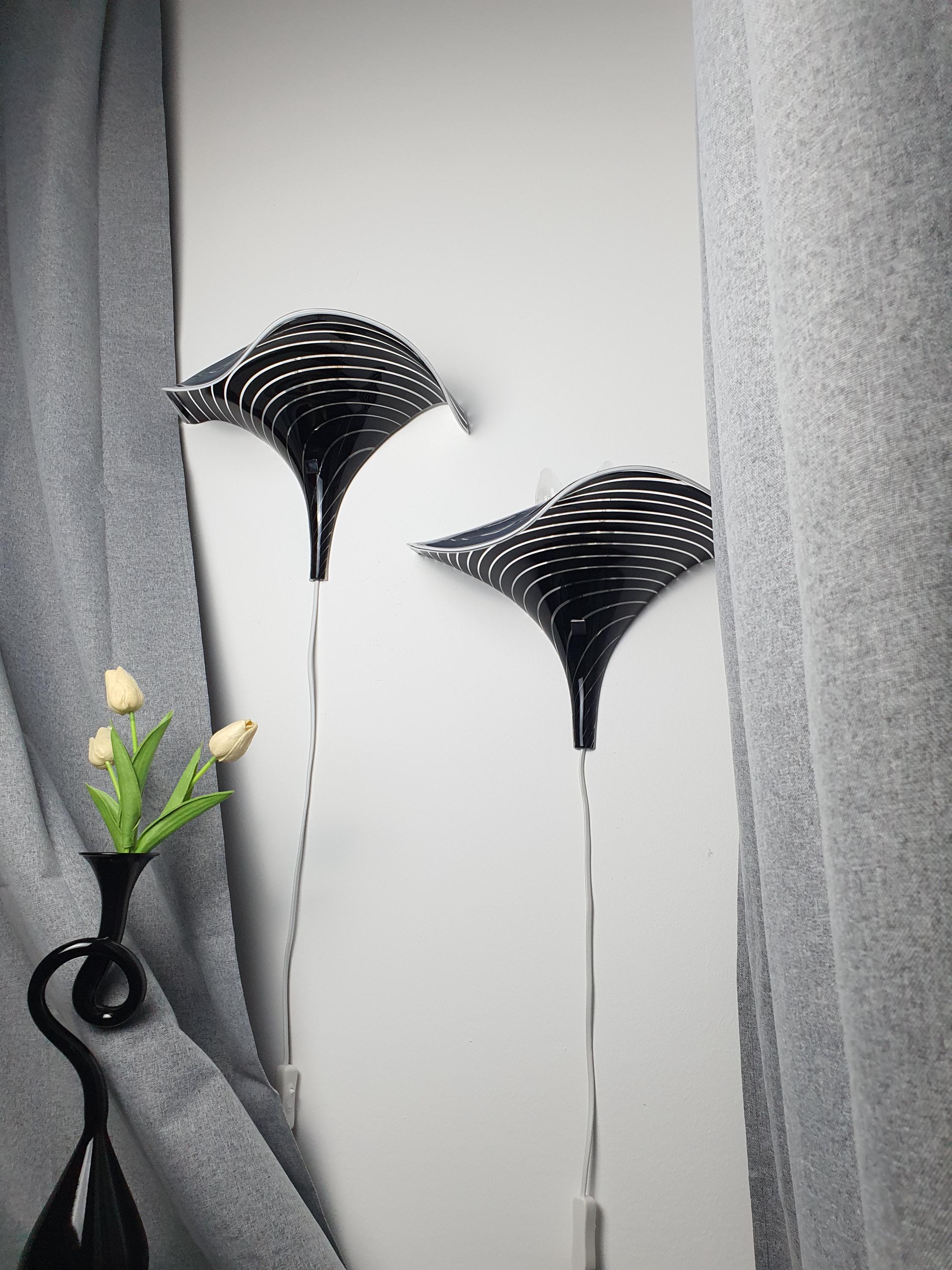 Vintage Murano calla lily wall sconce front view, black and clear zebra stripe layered glass, organic wave silhouette, floral form