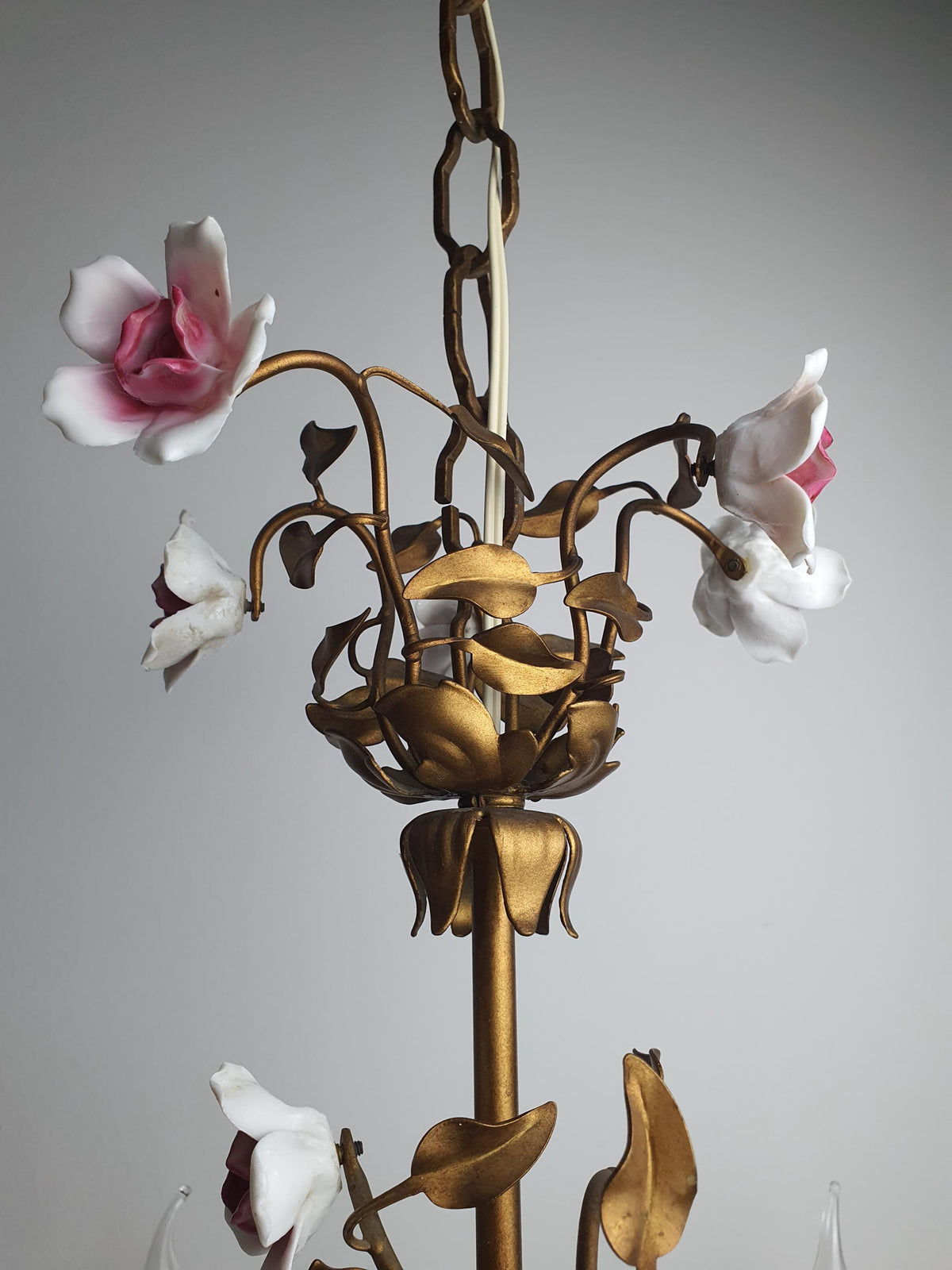 Decorative metal leaves and curved branches on a vintage Vanotti chandelier
