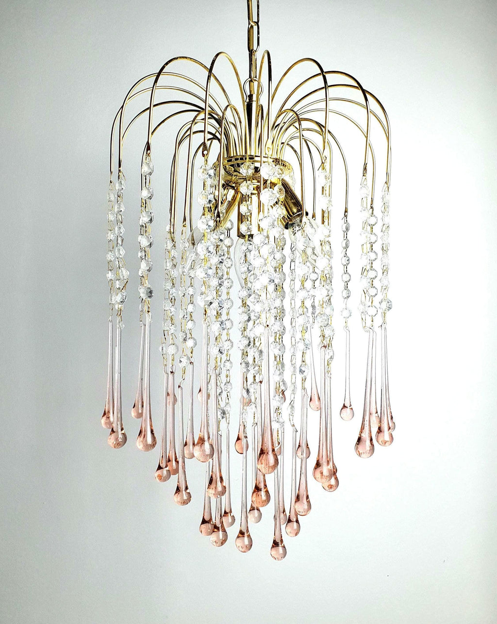 Vintage Murano glass chandelier with cascading pink teardrop elements in Hollywood Regency style
