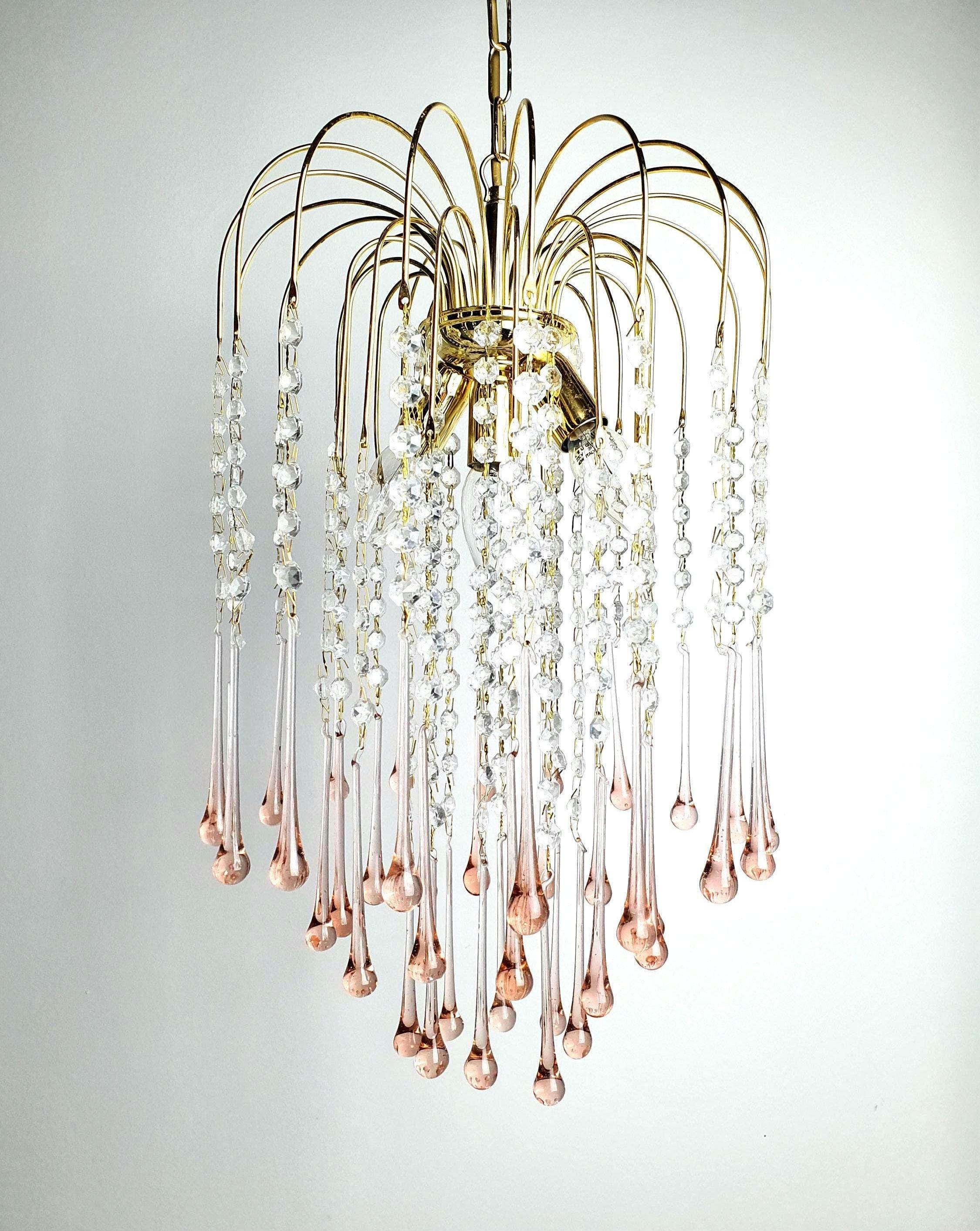 Vintage Murano glass chandelier with cascading pink teardrop elements in Hollywood Regency style