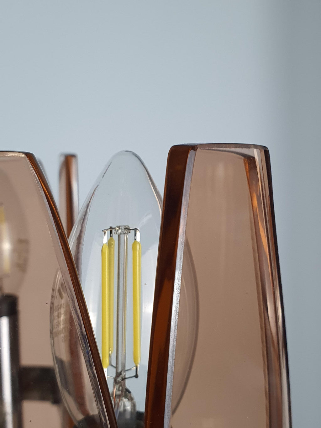 Veca 1970s chandelier — downward-facing pink glass shade, close-up