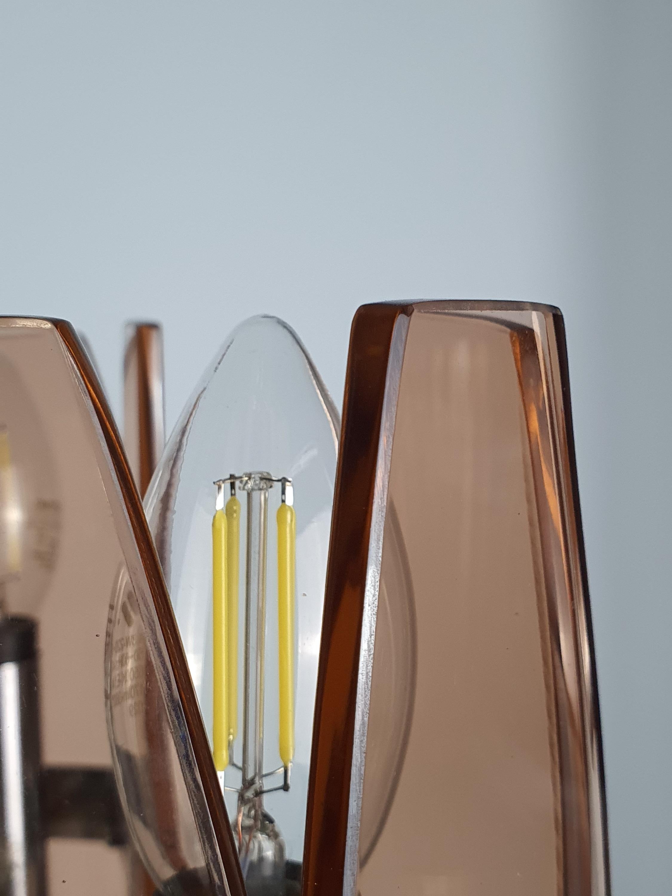 Veca 1970s chandelier — downward-facing pink glass shade, close-up