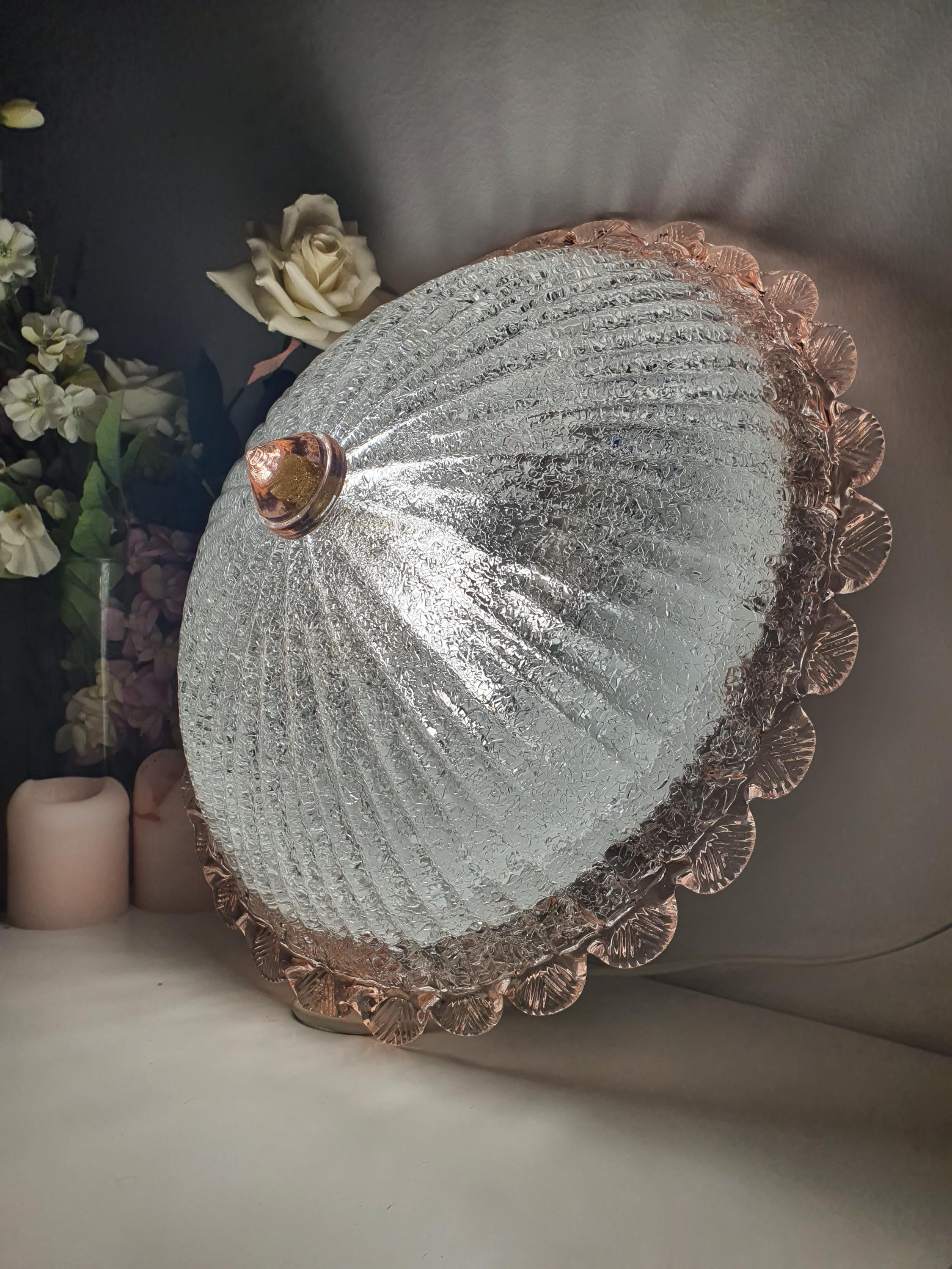 Murano floral flush mount front view, central cone glass diffuser, frosted shell relief, pink rim, smooth luminous exterior

