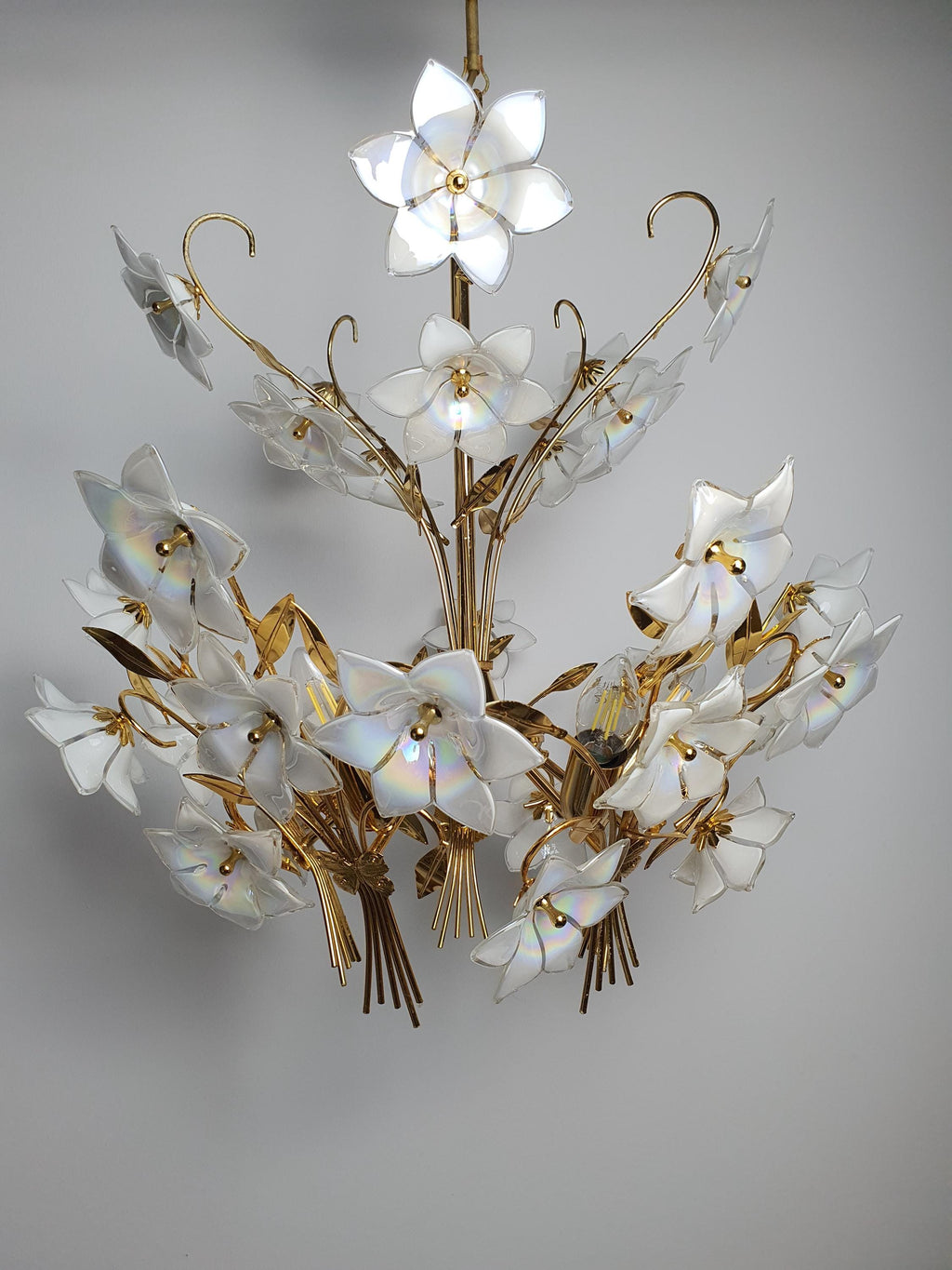 Murano glass bouquet chandelier front view, abundant iridescent white flowers on gold-toned 5-arm structure