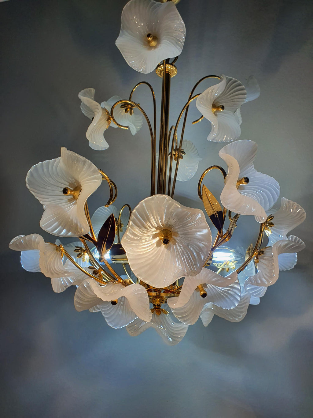 Vintage Murano white flower bouquet chandelier in bedroom, soft white petal glow, gold frame, Hollywood Regency romantic